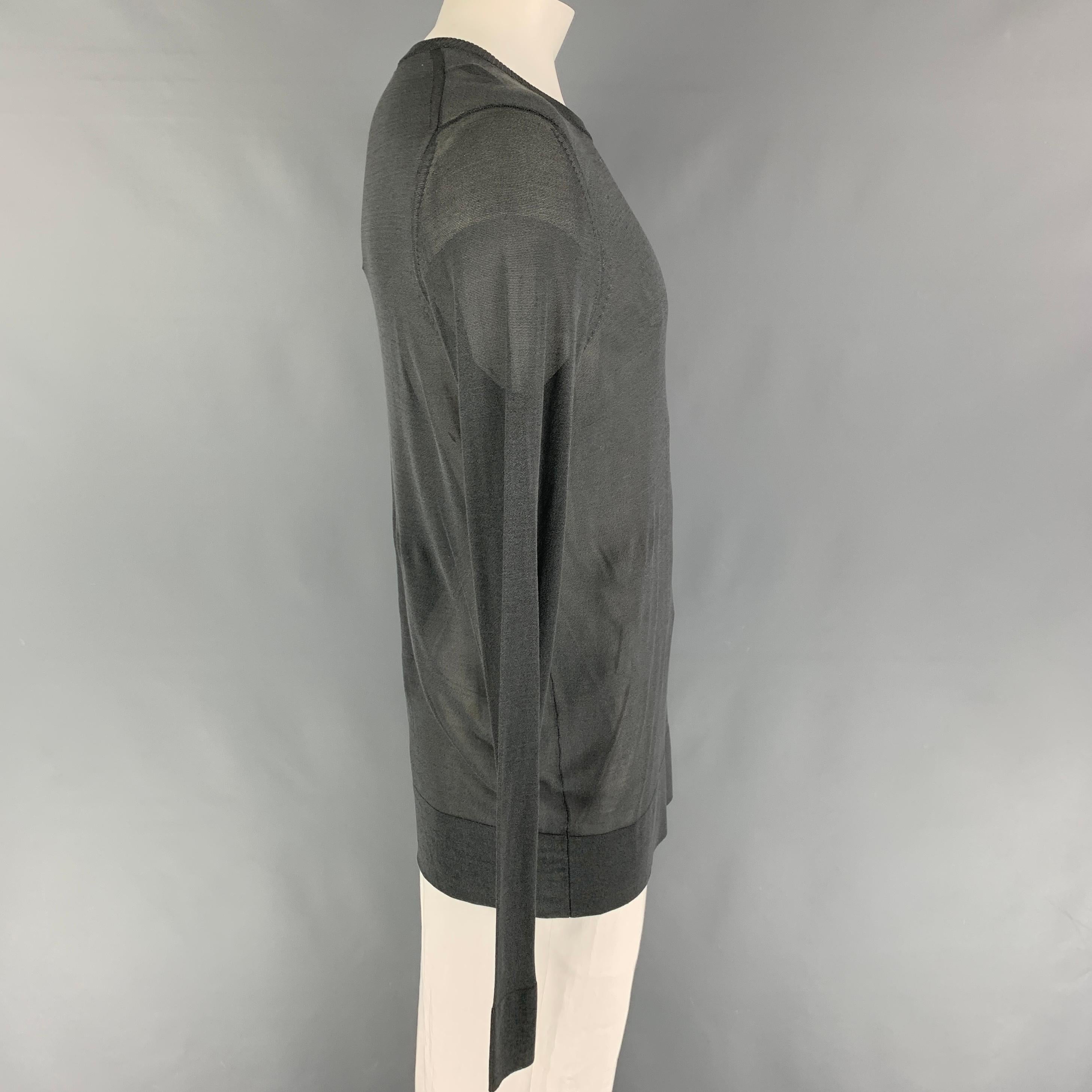 Y-3 by YOHJI YAMAMOTO pullover comes in a grey viscose featuring a crew-neck. 

Very Good Pre-Owned Condition.
Marked: XL

Measurements:

Shoulder: 19 in.
Chest: 42 in.
Sleeve: 34 in.
Length: 32 in. 