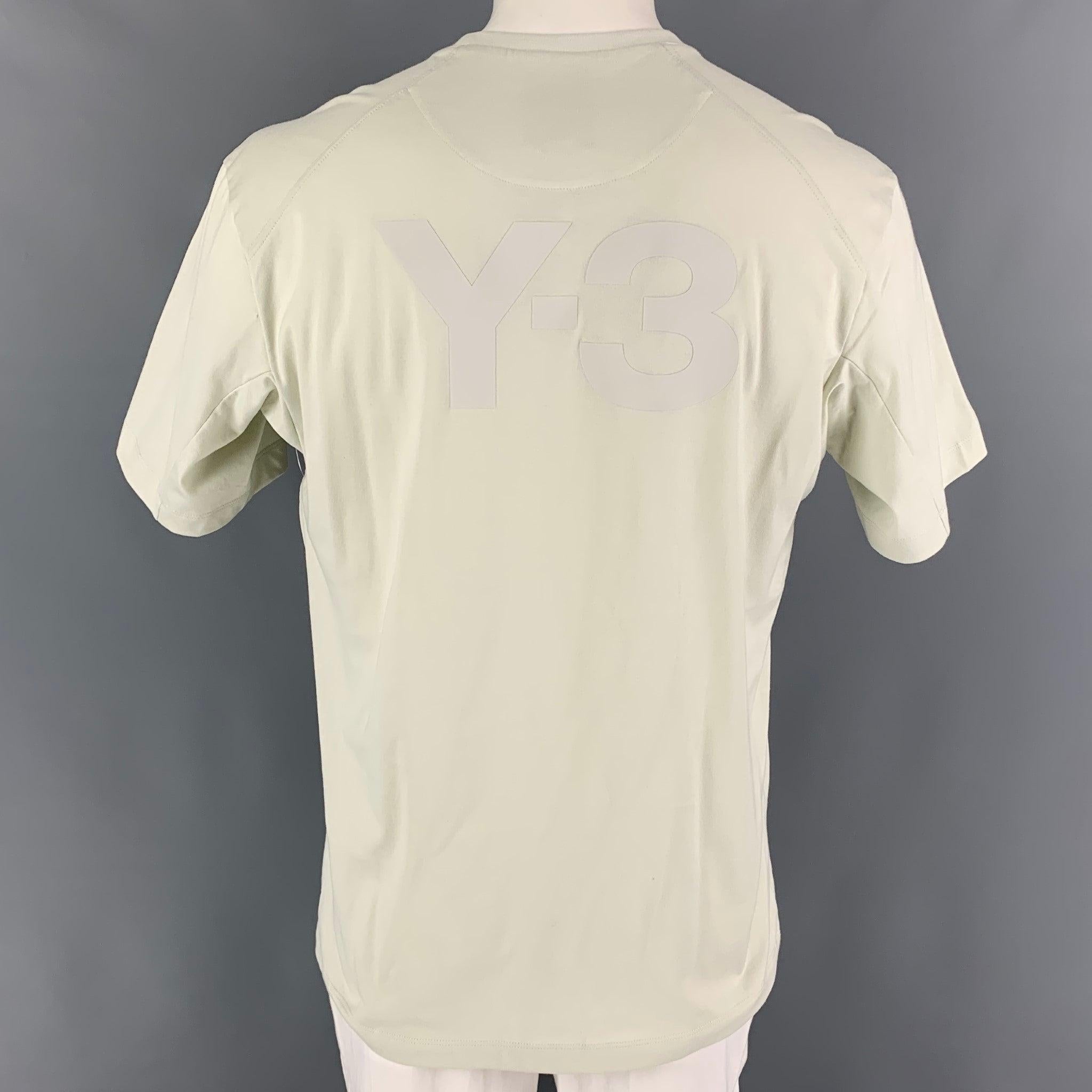 Y-3 t-shirt comes in a natural cotton featuring a back logo design and a crew-neck.
Very Good
Pre-Owned Condition. 

Marked:   L  

Measurements: 
 
Shoulder: 20 inches Chest: 42 inches Sleeve: 10 inches Length: 29 inches 
  
  
 
Reference: