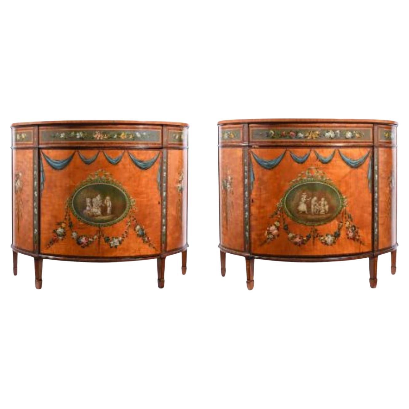 Y A Pair of Satinwood, Kingwood and Polychrome Painted Bow Front Commodes For Sale