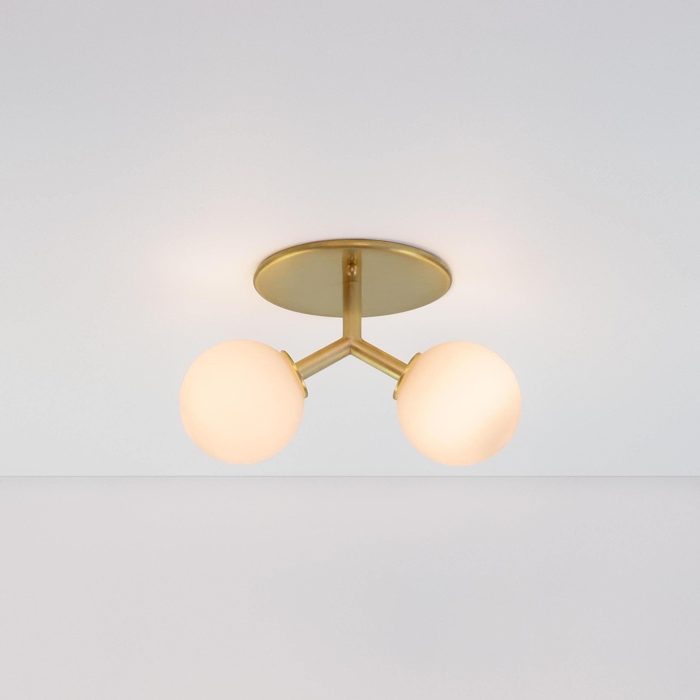 This listing is for 1x Y Flush Mount in Brass designed and manufactured by Research Lighting.

Materials: Brass & Glass
Finish: Raw Brushed Brass 
Electronics: 1x G9 Socket, 2x 2.5 Watt LED Bulbs (included), 500 Lumens total
UL Listed. Made in the