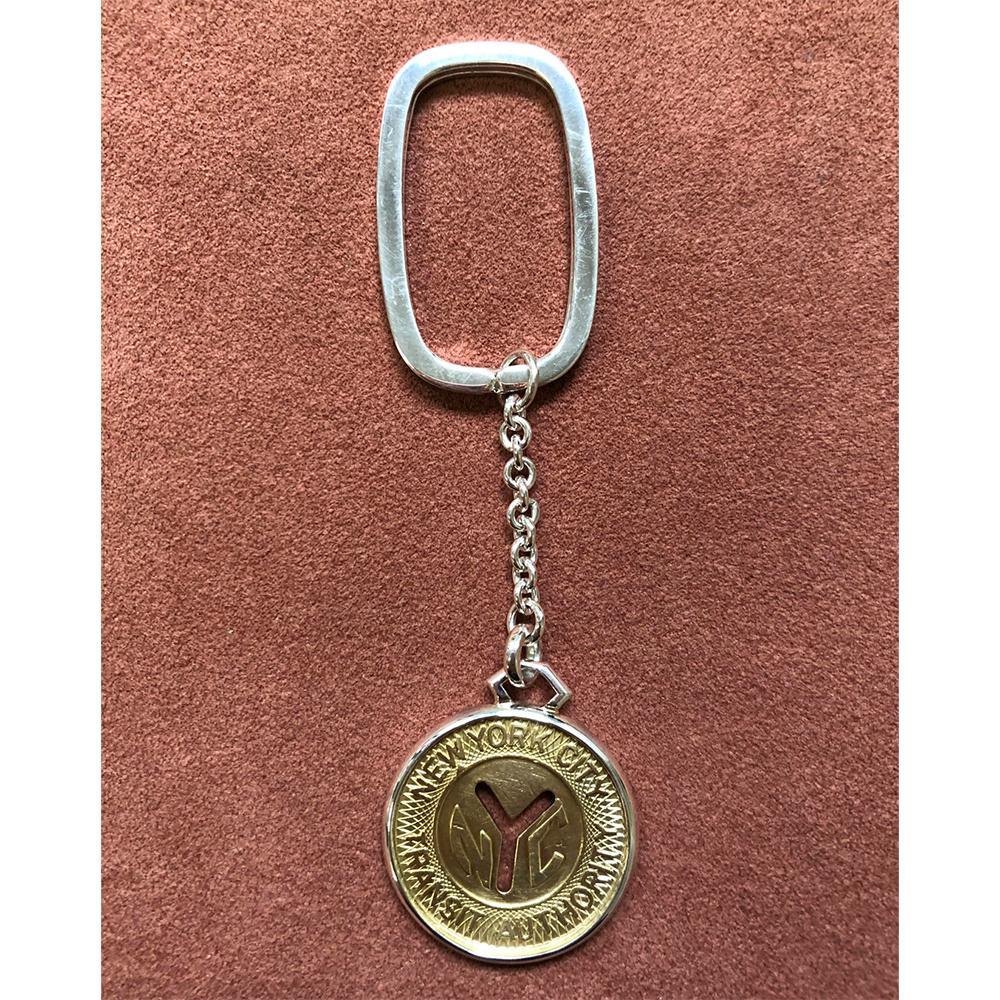 Elevate your everyday essentials with the exquisite craftsmanship of Michael Bondanza Jewelry. Introducing our 925 sterling silver Keychain featuring the iconic NYC Large 'Y' Subway Token encased in a sleek rectangle design. Each piece is a