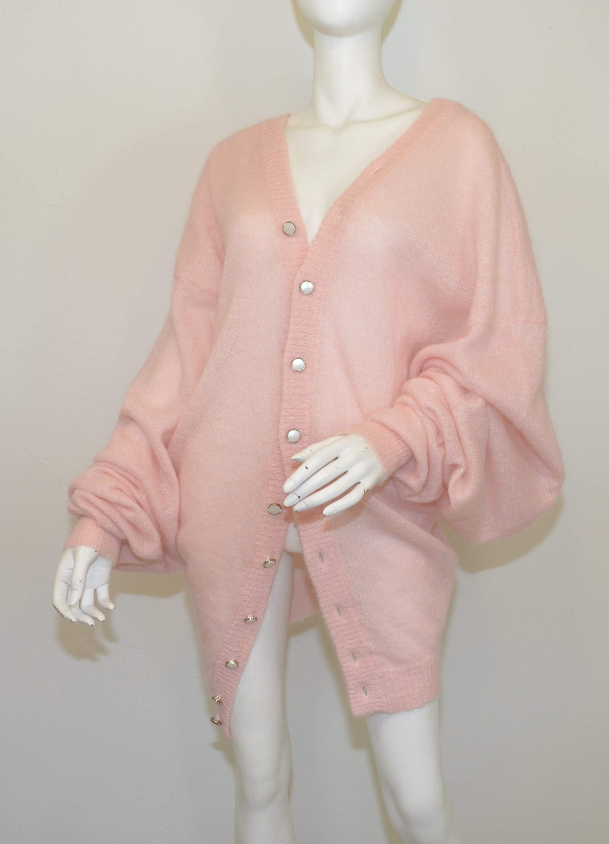Y-Project oversized cardigan sweater in pink, composed with 66% mohair, 30% polyamide, 4% wool, with buttons all along the opening to manipulate draping. Sweater is labeled a size small.

Measurements:
Bust 46”
Sleeves 35”
Length 29”