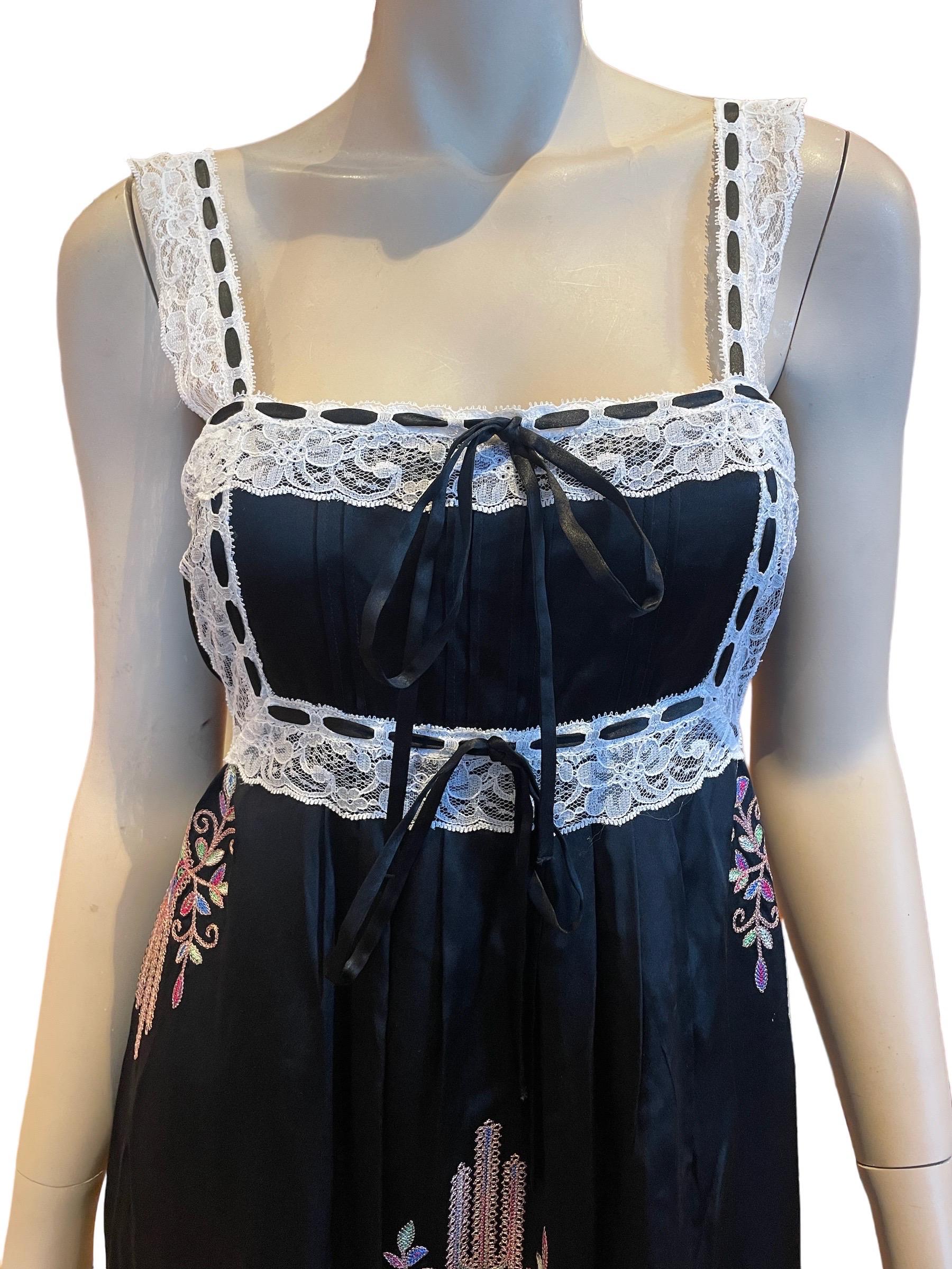 Y2K Black Betsey Johnson Baby Doll Slip Dress, Embroidered with Lace Trim Bodice 

Black Betsey Johnson babydoll slip dress with lace straps, adjustable satin ribbon eyelet tie bodice, and pink-green-blue embroidery. Hidden side zipper, midi length. 