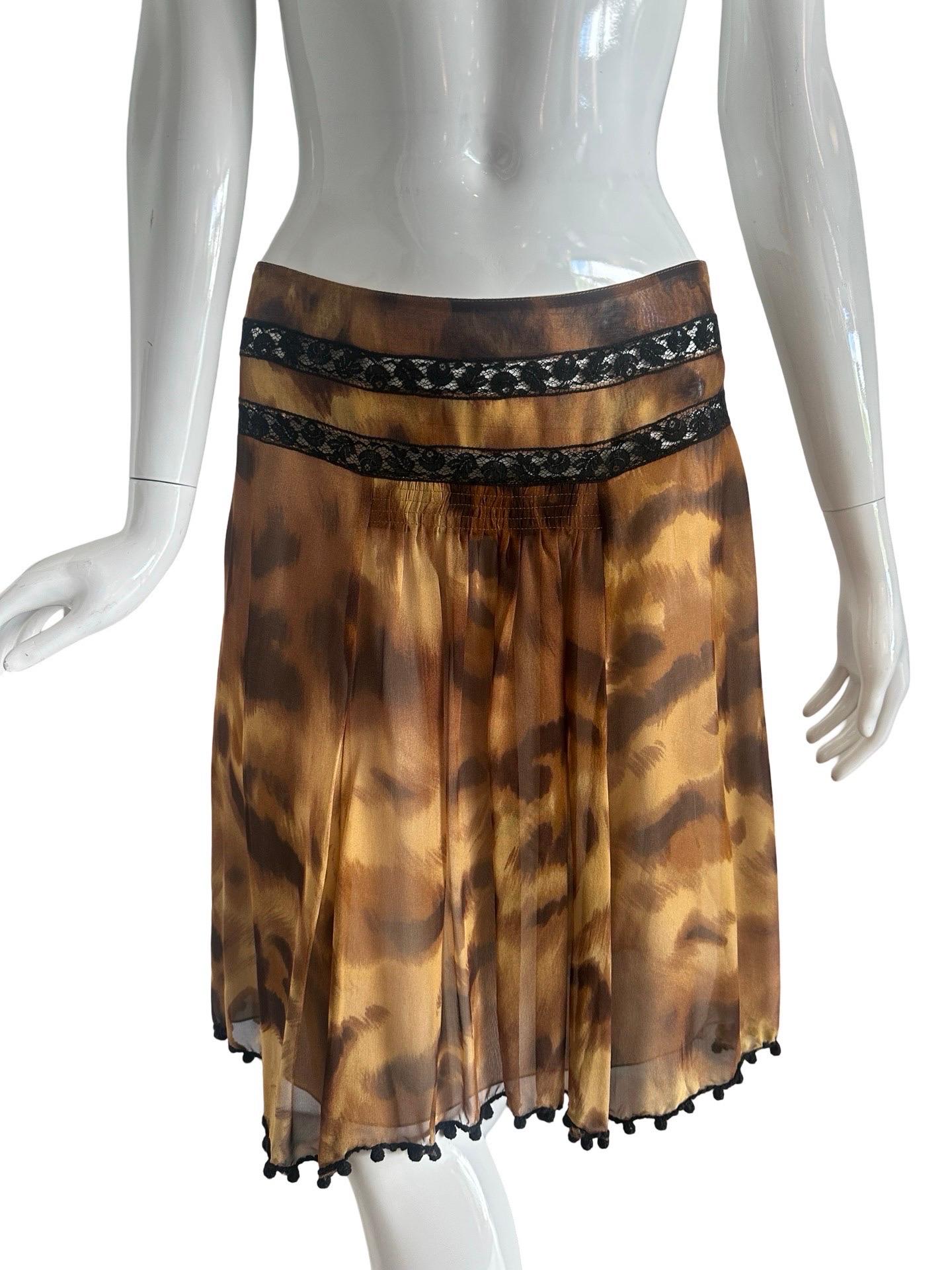 Y2K Blumarine skirt in an animal leopard print on chiffon silk.  Soft and flowy with a nude sheer layer underneath.  Pleats fall from a section of smocking on the front and the back.  Two sheer panels of black lace run around the hip and the hem is