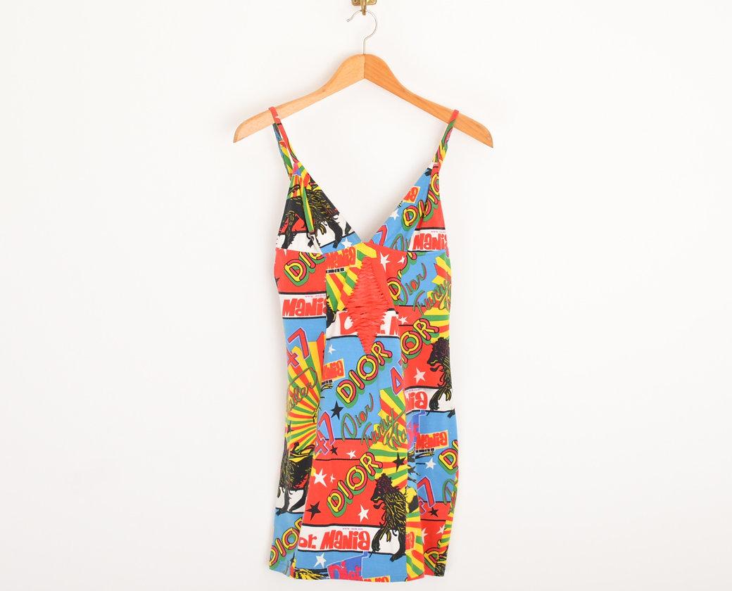 Iconic Spring / Summer 2003 CHRISTIAN DIOR by JOHN GALLIANO 'Rasta Mania' spaghetti strap, cotton mini dress. 
 
Features;
Fully adjustable shoulder straps
Red lace-up corset style panelled front detailing
Figure hugging stretchy shape
Above knee