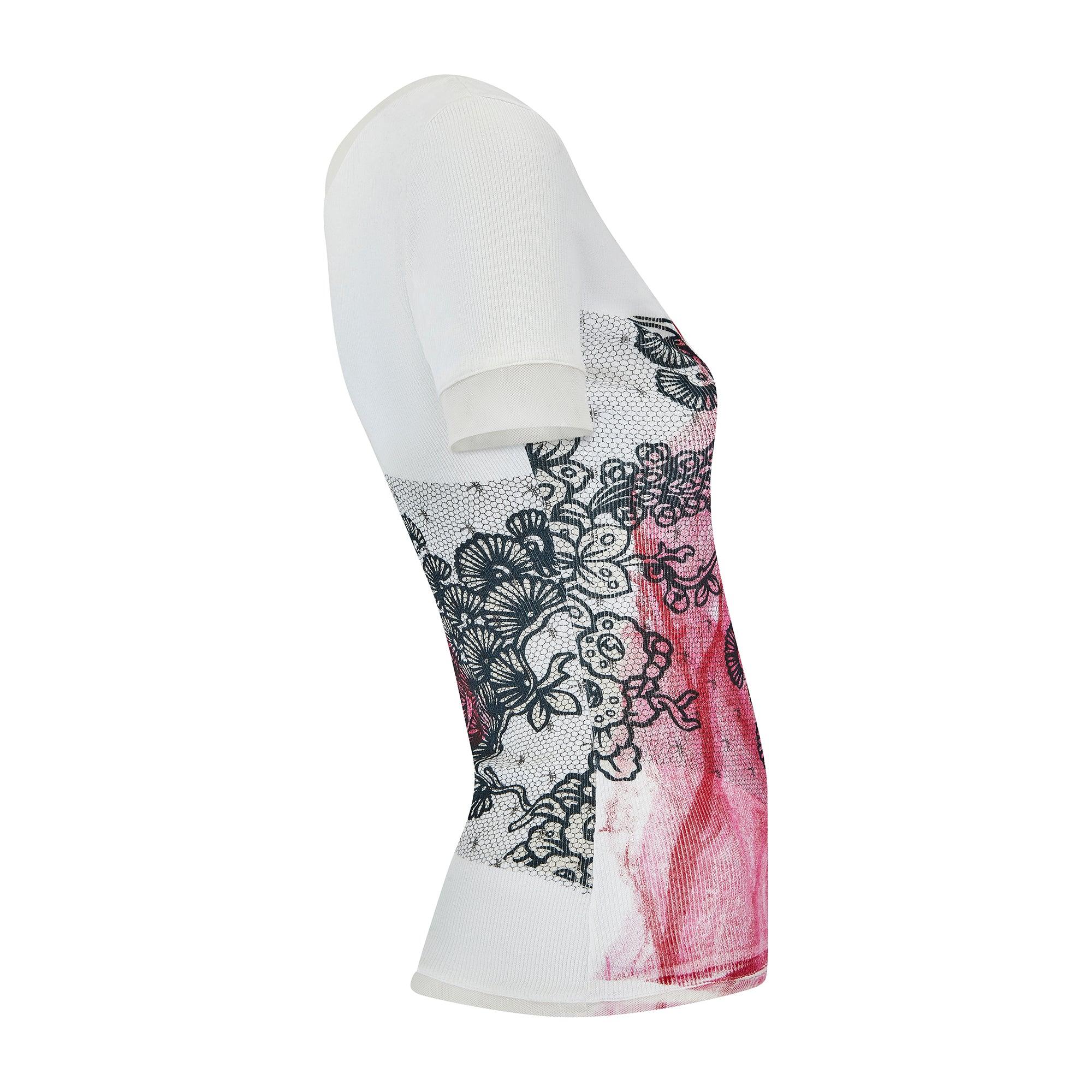 This Christian Dior t-shirt dates back to the brand's highly sought-after noughties era when John Galliano was at the creative helm of the house. This short-sleeve top is cut with a scoop neckline and trimmed with sheer mesh at the sleeves, neckline