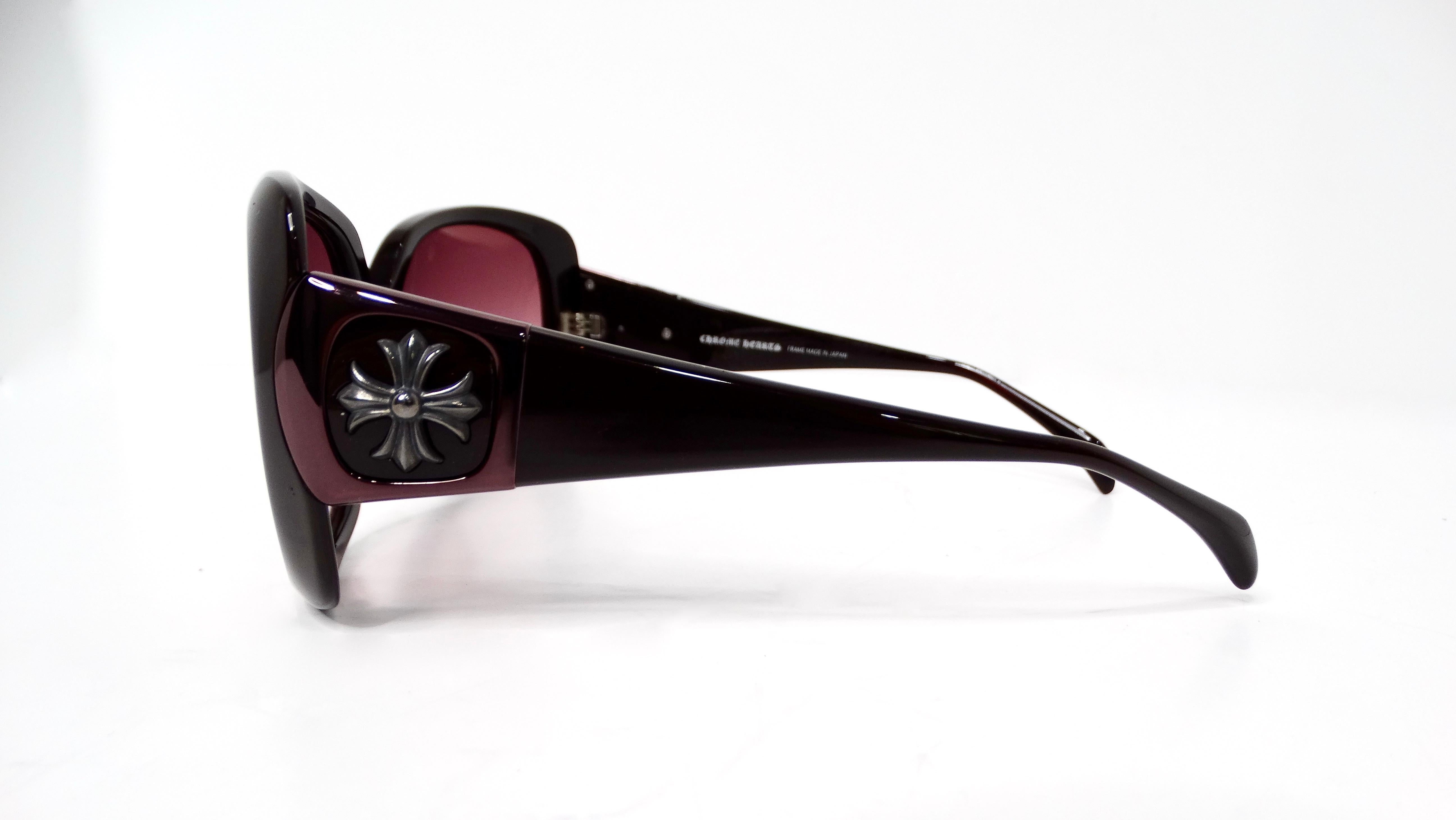 Introducing the Y2K Chrome Hearts Oversized Chinnutz Sunglasses, a statement accessory that seamlessly blends high fashion with bold individuality. Featuring a striking black frame adorned with the iconic Chrome Hearts cross logo on the sides, these
