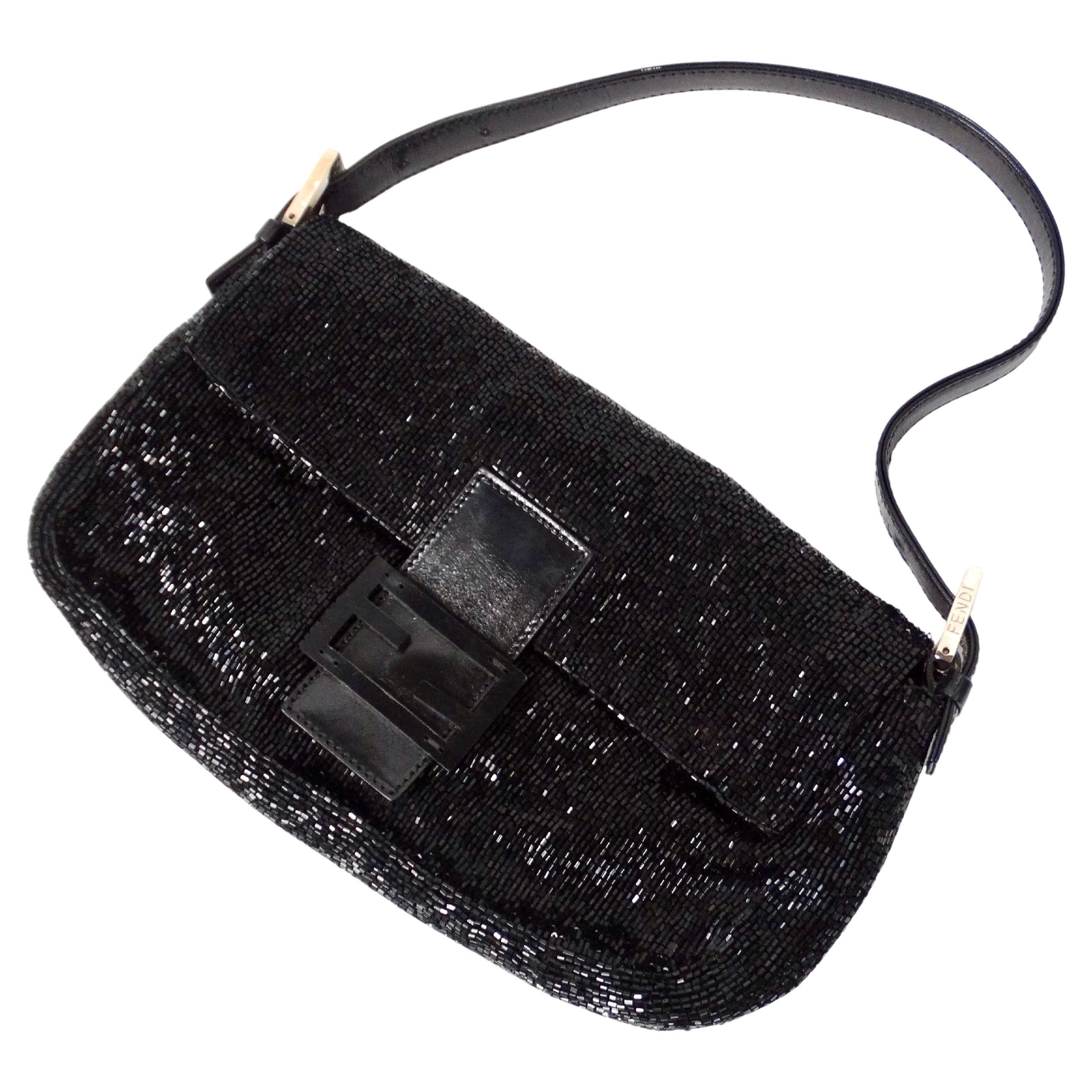 The Y2K Fendi Black Beaded Baguette Shoulder Bag is a quintessential piece for fashion enthusiasts yearning to capture the essence of early 2000s style. This luxurious handbag features intricate beadwork that exudes elegance and sophistication,