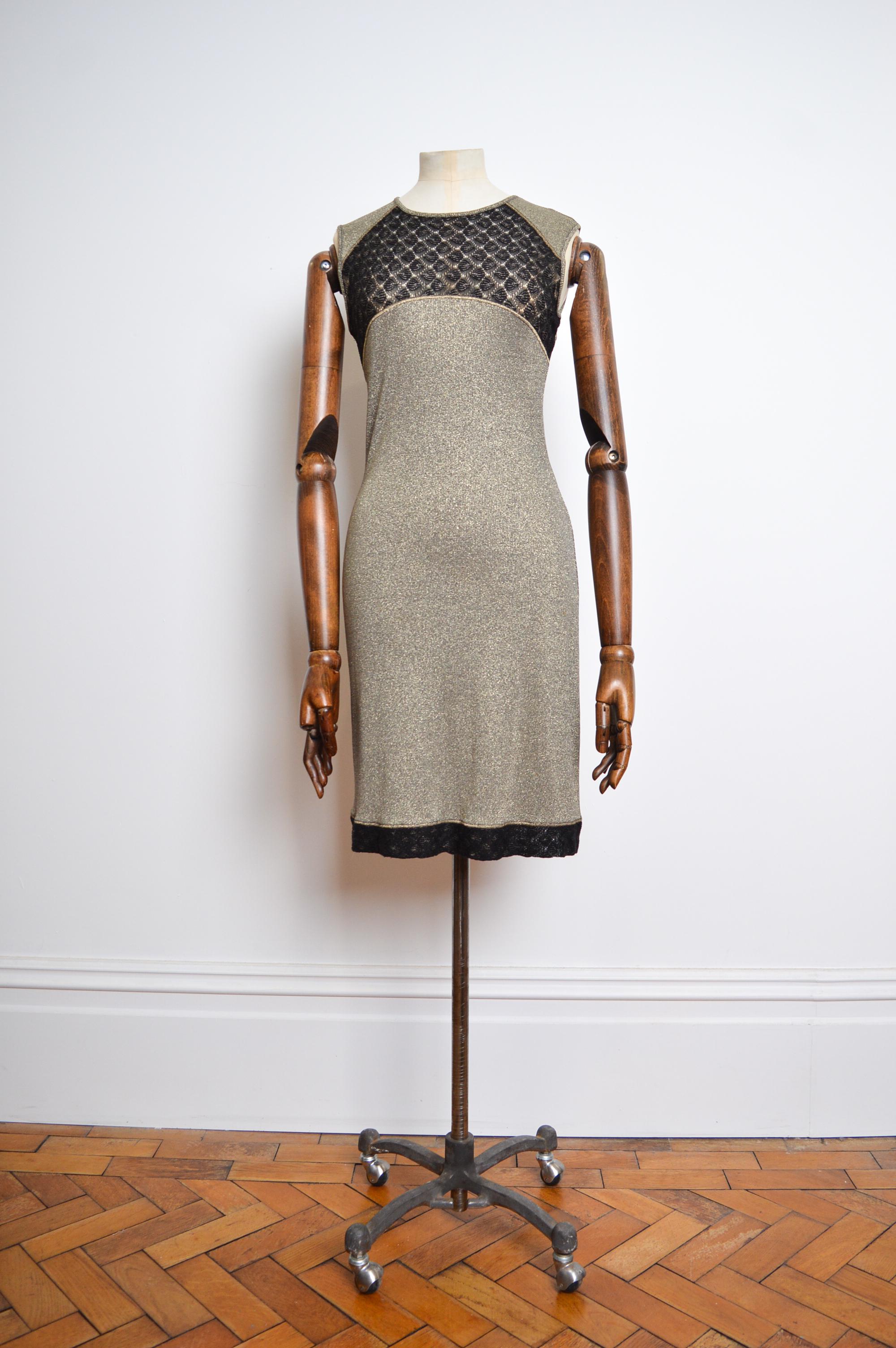 Chic, 2000's Vintage Mini dress by Christian Lacroix, in a shimmery Gold Lamé Knit with  a sheer lace panel detailed front and printed signature logo reverse. 

MADE IN ITALY.  

Pit to pit - 16-18