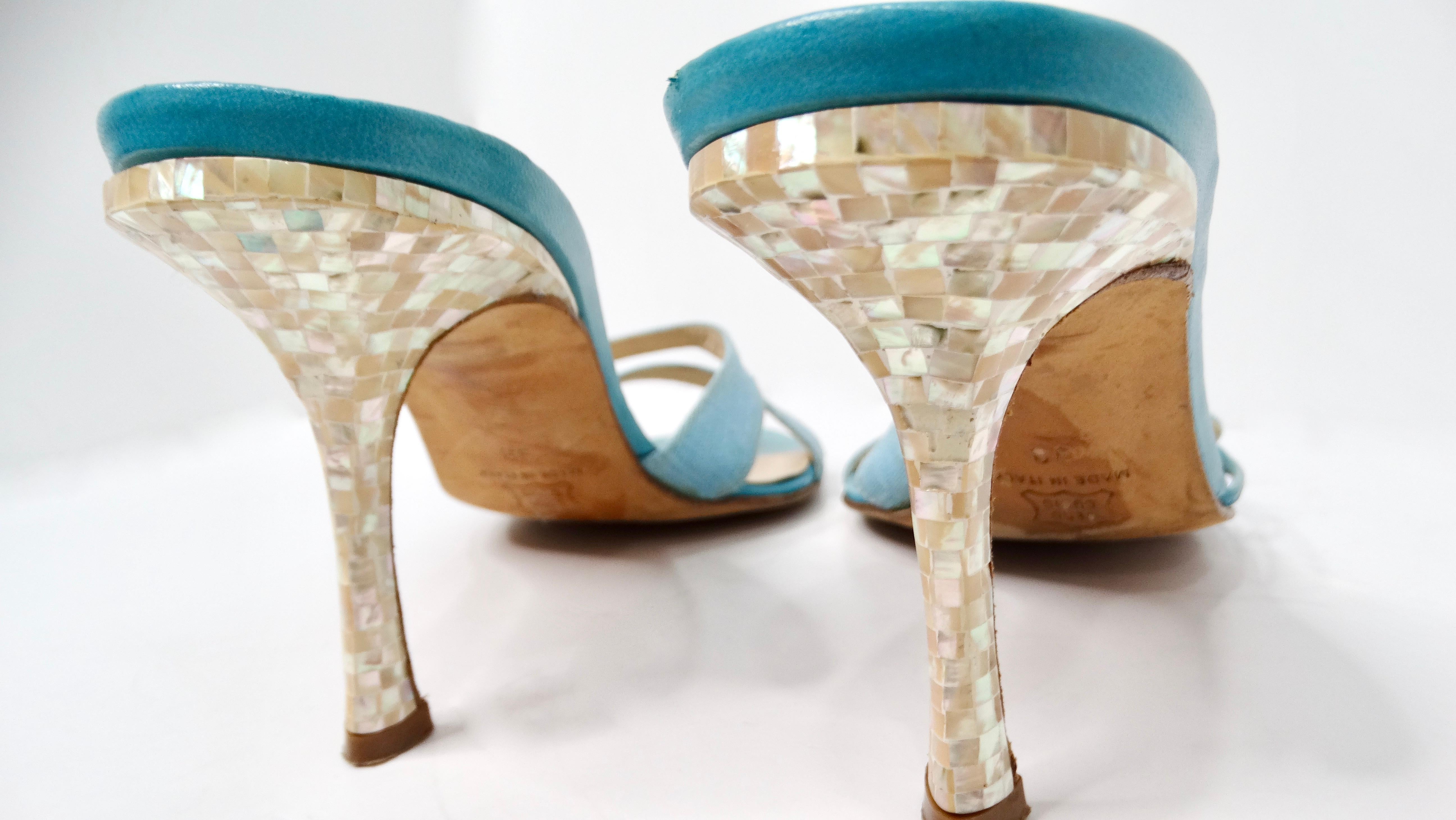 Step into a world of elegance and nostalgia with the Y2K Jimmy Choo Blue Mother Of Pearl Detailed Kitten Heel Sandals. These stunning blue sandals showcase a unique design featuring raw-edge mother of pearl style detailing that adds a touch of