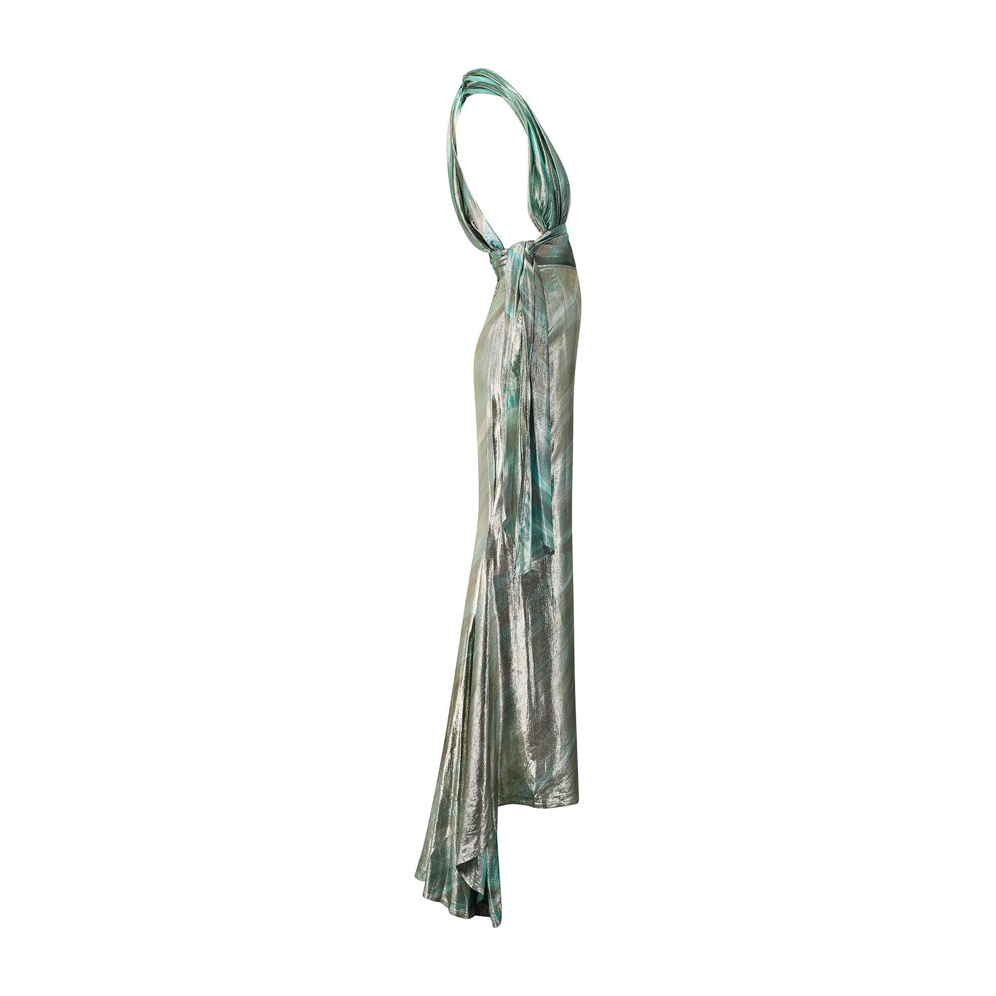 This spectacular Y2K lamé top and skirt ensemble were couture crafted by Manfred Thierry Mugler circa 1998 to 2001. Designed by the master of empowering, hyper-feminine tailoring, the ensemble twists around the body in a manner that recalls Grecian