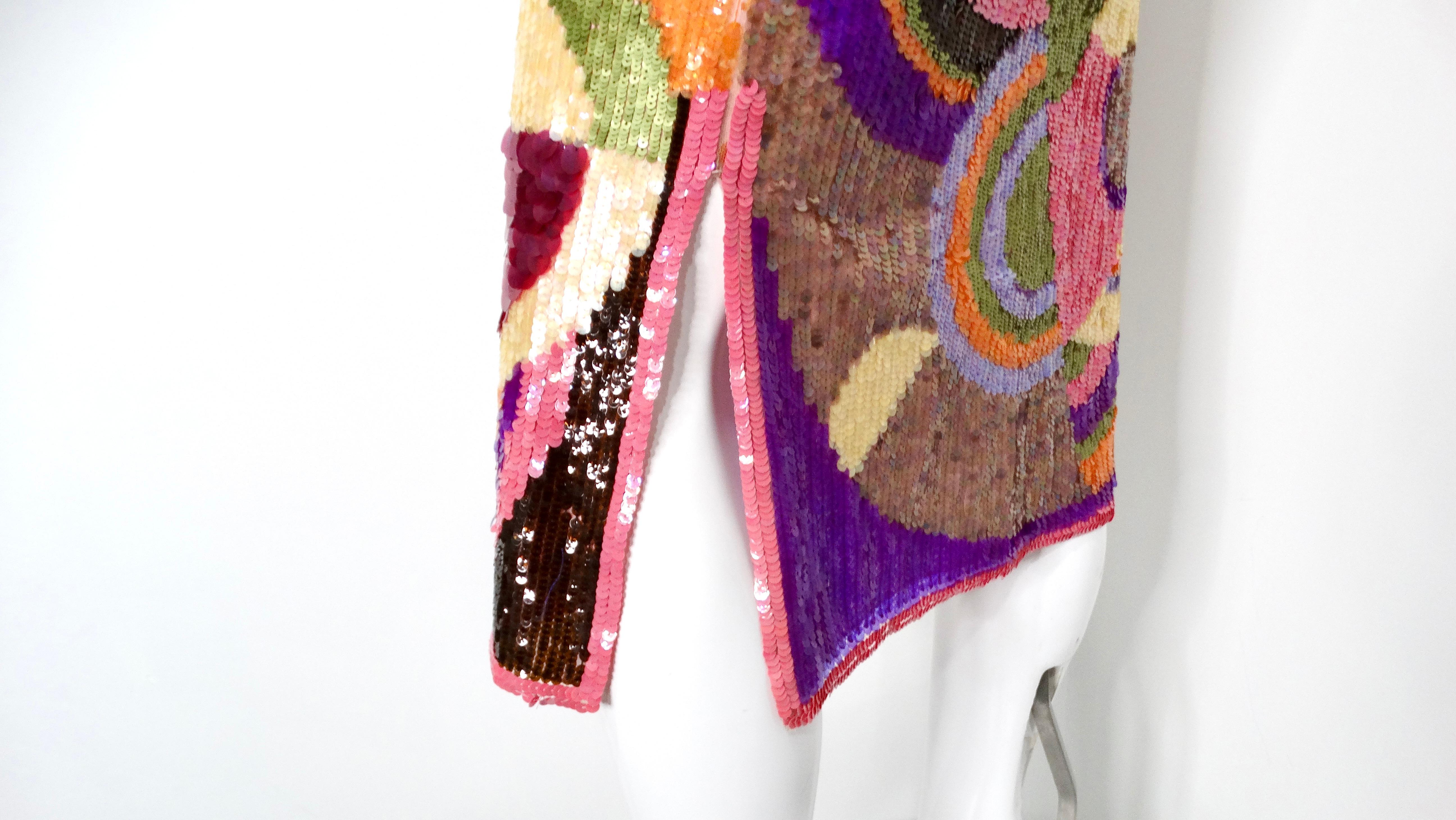Voici la jupe à paillettes abstraites multicolores de Valentino CIRCA, une pièce saisissante qui capture l'essence de la mode du début des années 2000. Cette jupe au genou se compose d'un luxueux tissu de soie orné d'un imprimé géométrique vibrant