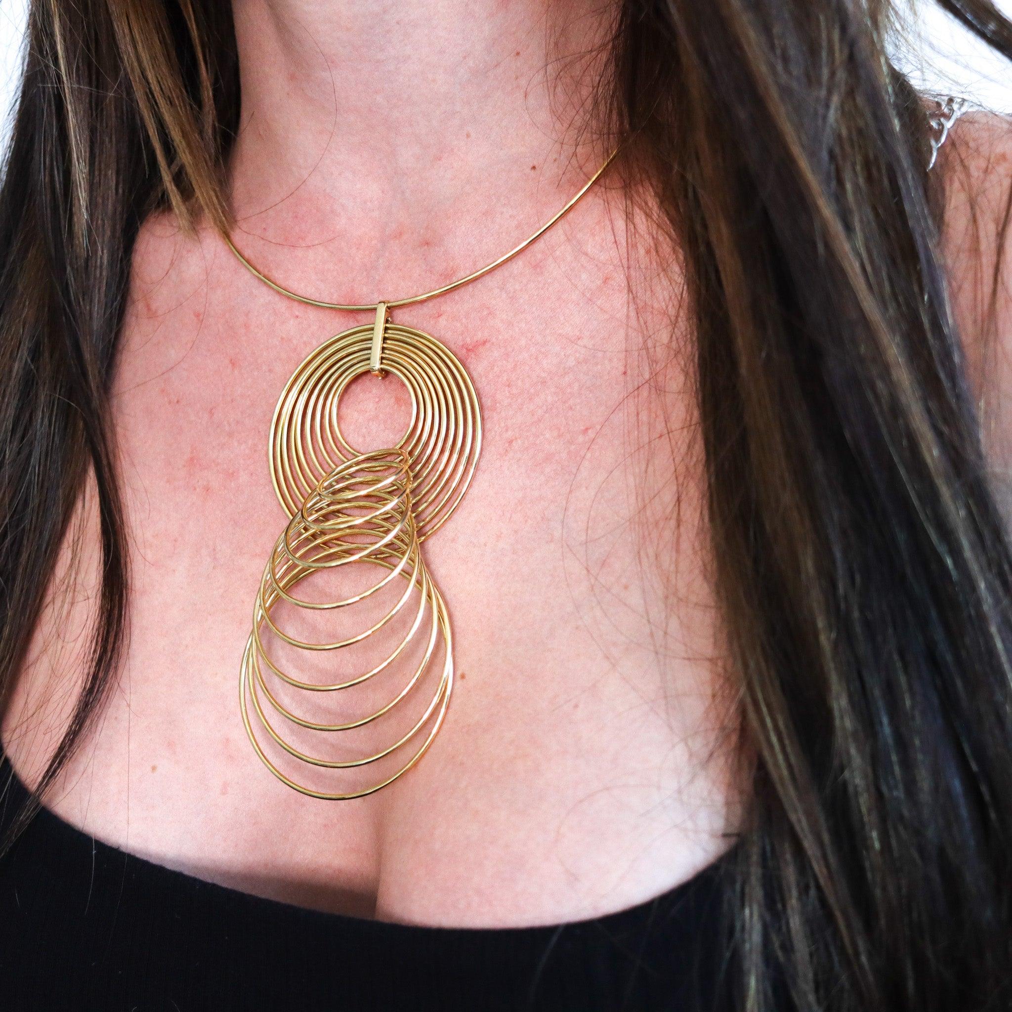 Kinetic Op-Art necklace designed by Yaacov Agam (1928-).

This is a gorgeous piece of wearable art, created in Paris France by the French Israeli artist Yaacov Agam, back in the 1970. The kinetic Op-Art necklace was masterfully crafted in rich