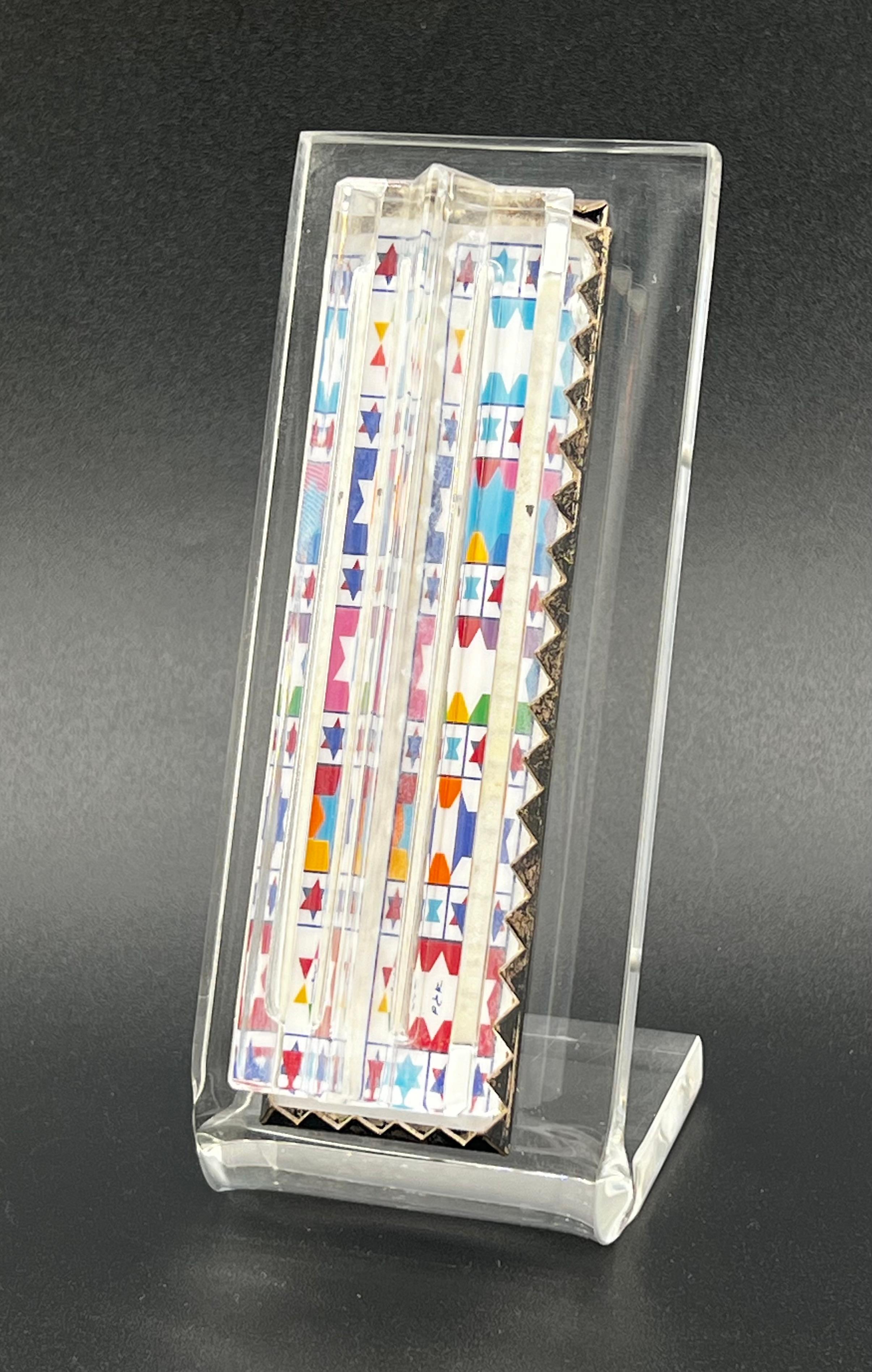 Yaacov Agam & Daum Sterling Silver Limited Edition Mezuzah. Numbered 189/360. Beautiful crystal glass in the shape of Star of David. mounted in Sterling Silver on acrylic plaque. Original school encapsulated inside Mezuzah.  Overall excellent
