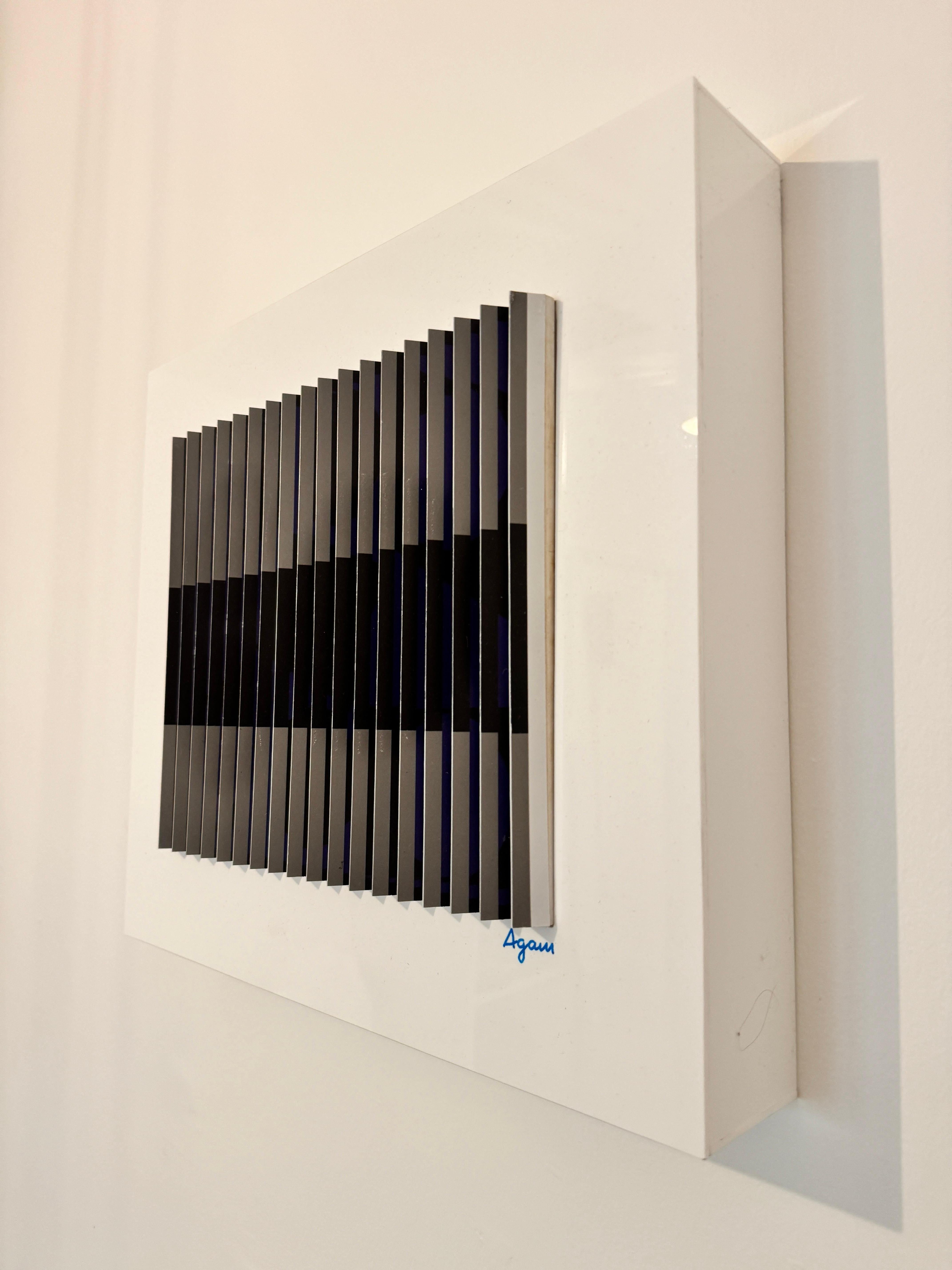 This is an authentic Polymorph kinetic art work by world-renowned Israeli artist Yaacov Agam (b. 1928), one of the leading figures in Op Art and Kinetic Art. It is hand singed on bottom right and numbered on the bottom (see images)


