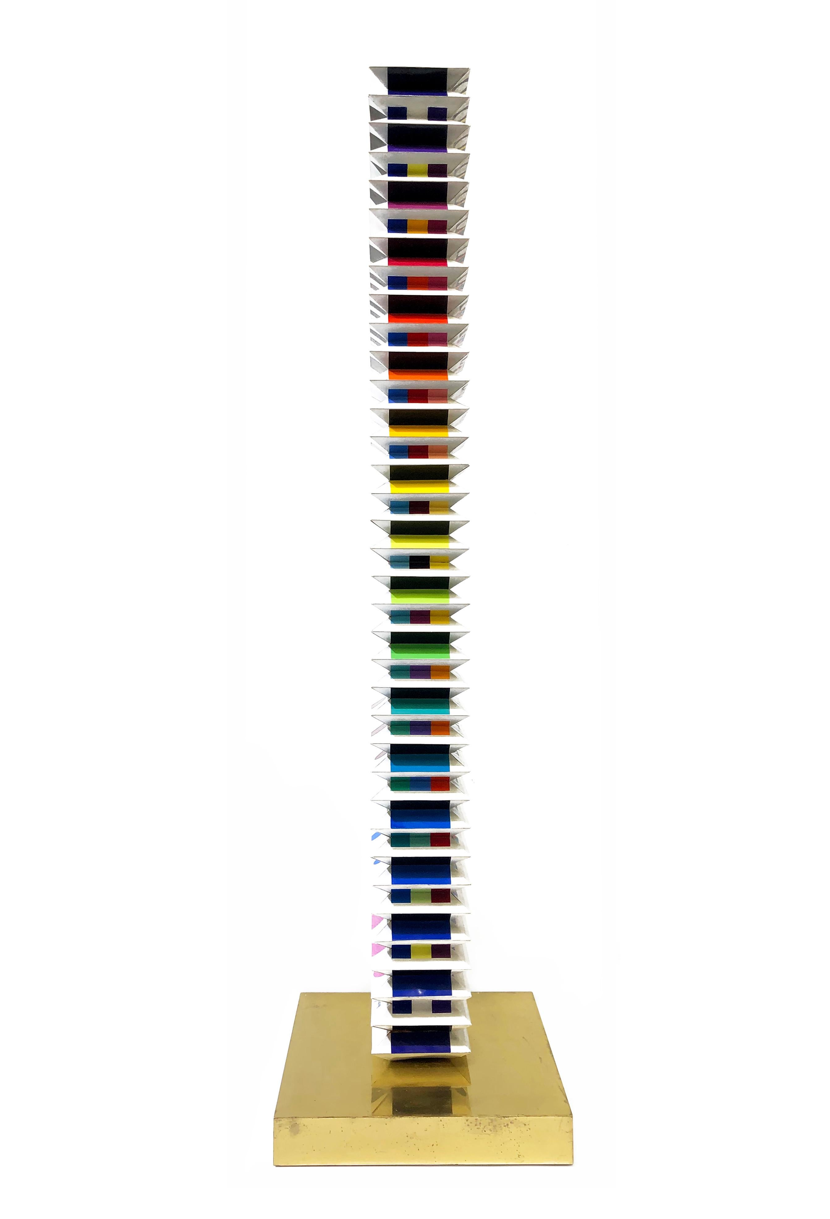 Multi dimensional tower sculpture (polymorph screen print on folded PVC) on brass base.  Hand signed by Yaacov Agam.  Hand numbered 66/150 (slightly faded - see pic).  Size: 34.25 x 8.75 x 8.75 inches.

Certificate of Authenticity Included. Artwork