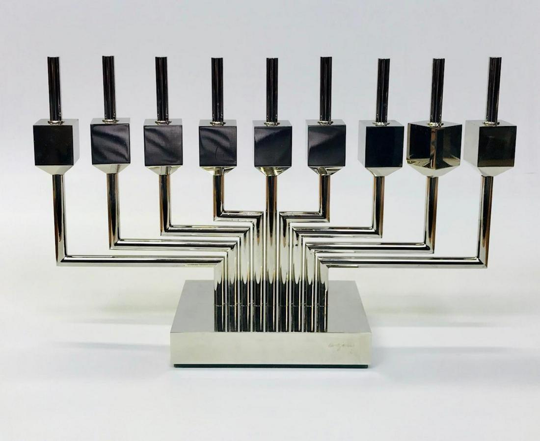 Amazing Brass silver color Hanukkah Dreidel Menorah Chanukiah by the Israeli artist Yaacov Agam ; Kinetic Work.
signed on base, numbered '8/9' A.P. made at 1979
