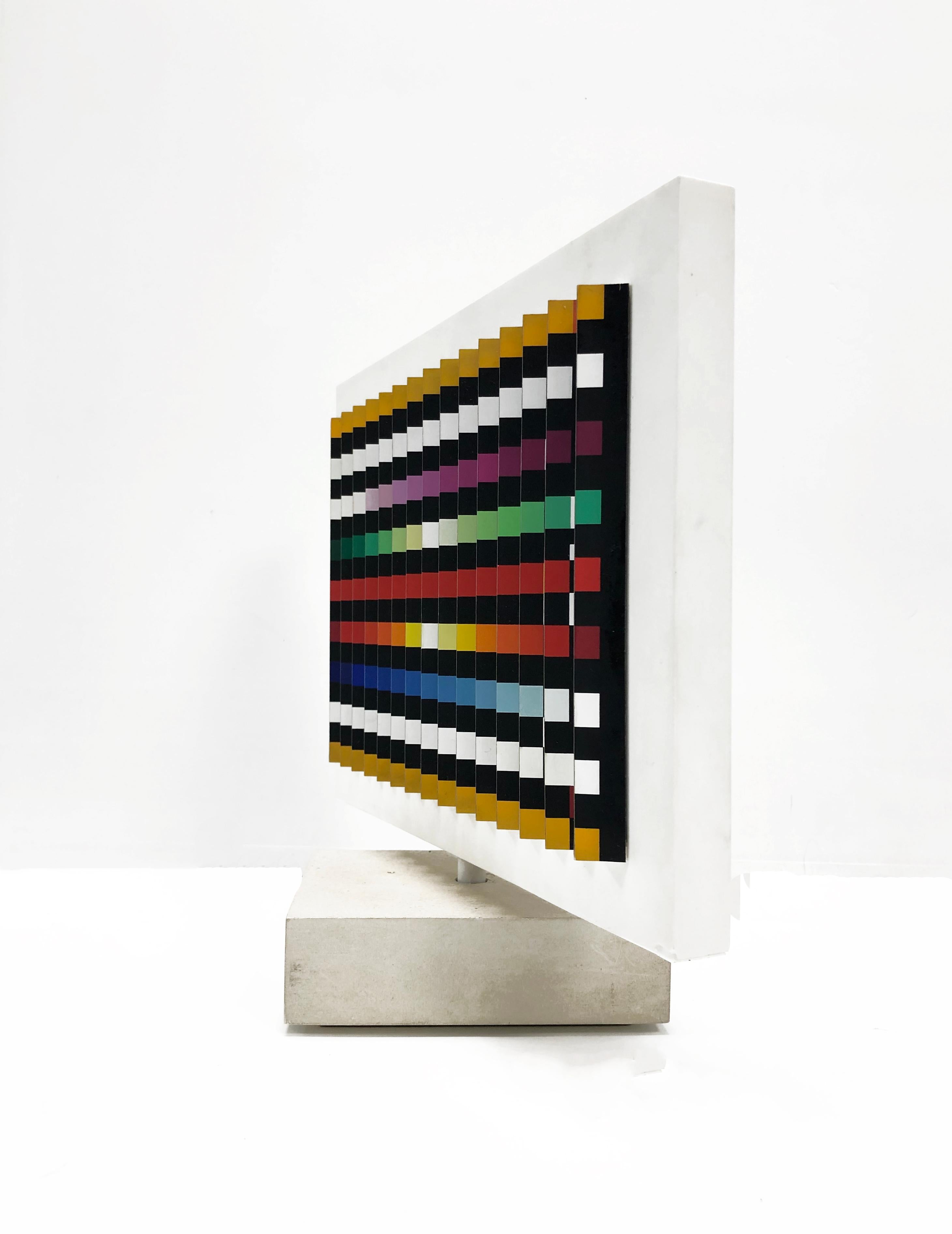 Double sided spinning polymorph kinetic sculpture made with silkscreen on folded PVC.  Measures 11.5 x 12.75 x 4.75 inches including wooden base.   Hand signed and numbered by Yaacov Agam on the underside.  Edition 76/150.

Additional images