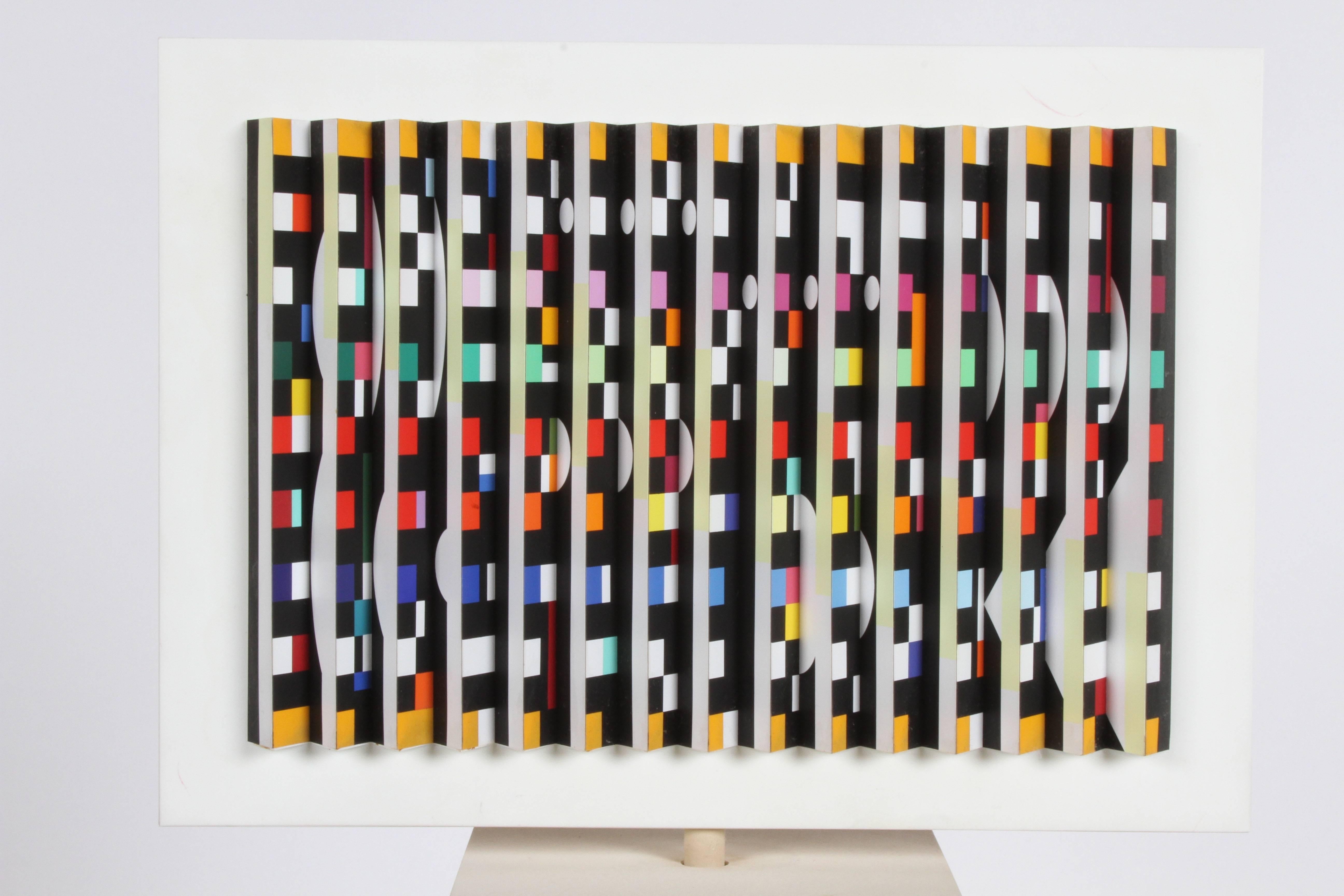 Yaacov Agam (b.1928) double sided spinning polymorph kentic sculpture. Silkscreen on folded PVC. Signed Agam and numbered to underside 105/150. This is number 105 from an edition of 150. Very nice condition, slight discoloration on base around hole.