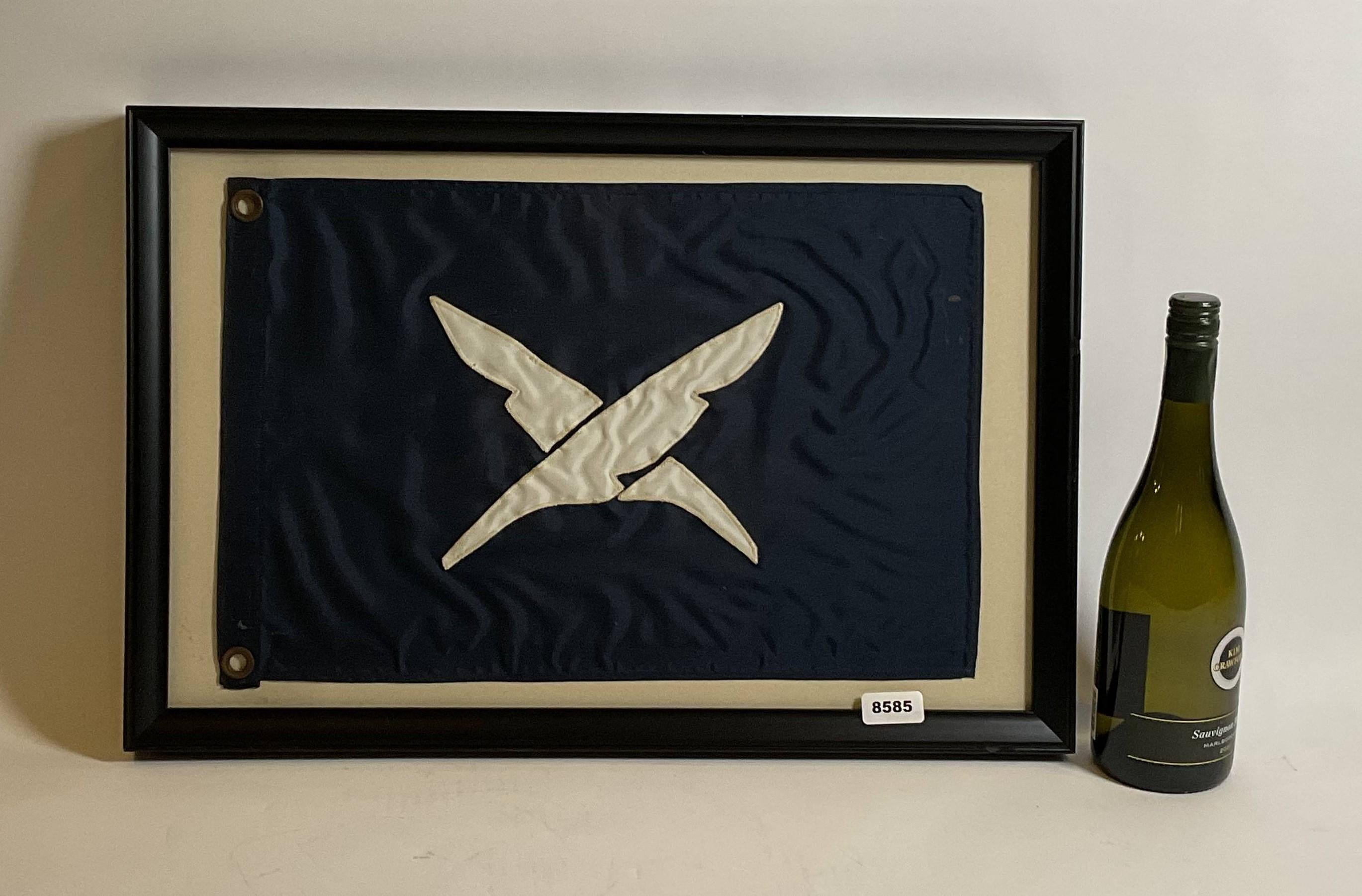 Nautical flag in frame with glass. Blue flag with crossed feathered quills. Blue field with white applied letters. White hoist with brass grommets.

Weight: 4 lbs.
Overall Dimensions: 15