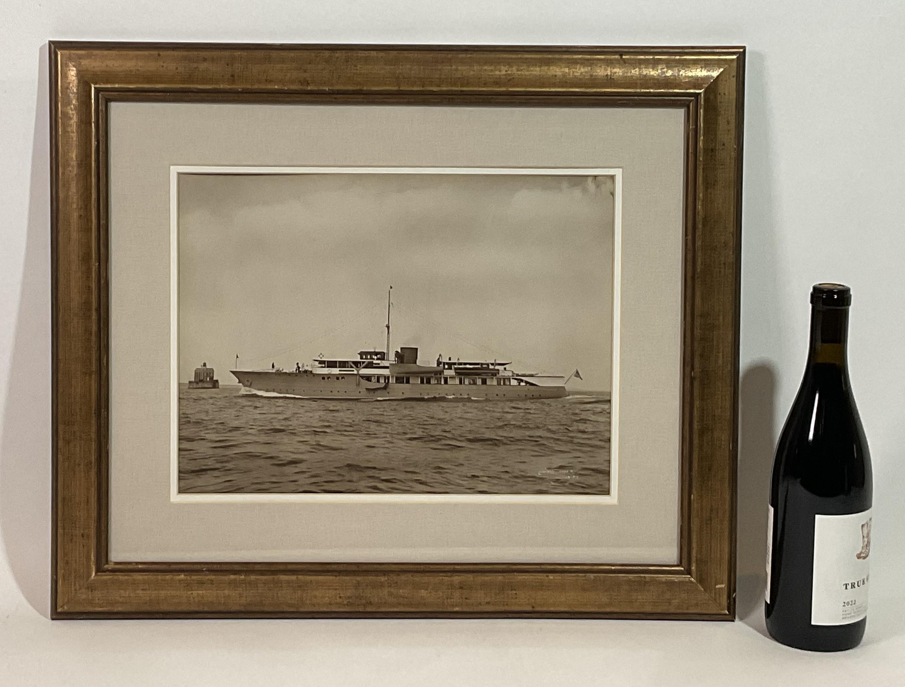 Rare photo print of the private yacht Lone Star by famous marine photographer Edwin Levick of New York. The yacht is seen passing the New London Ledge Lighthouse. Lone Star was owned by George Gault Bourne of the New York Yacht Club. The yacht was