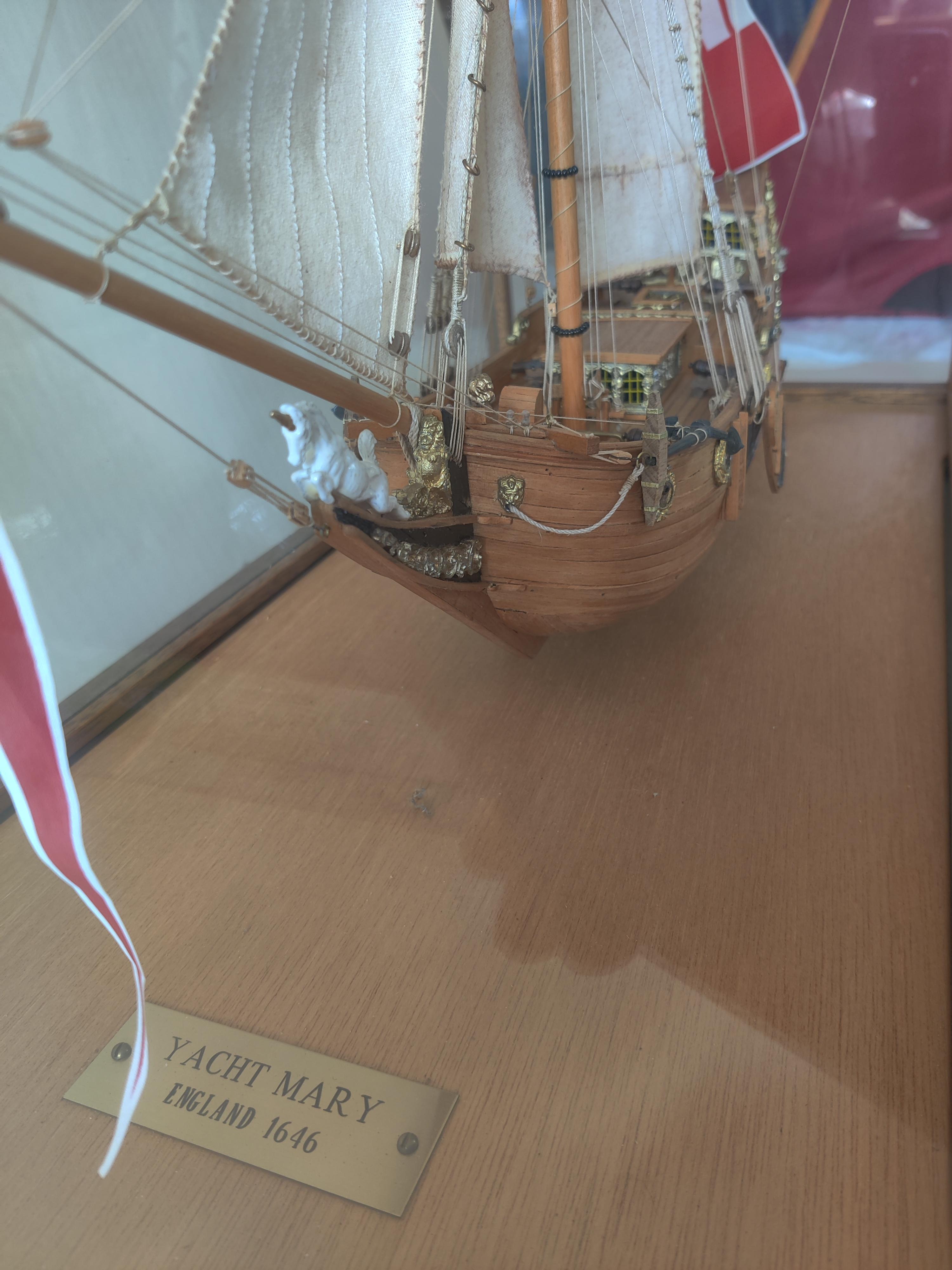 Yacht Mary Model Ship in Glass Oak Display Case
Ship dimensions 18 L x 3 W x 19.75 H
Vintage Ship Kit.   Ship is in excellent condition.
Case has slight wear. 
Brass stamp plate states 