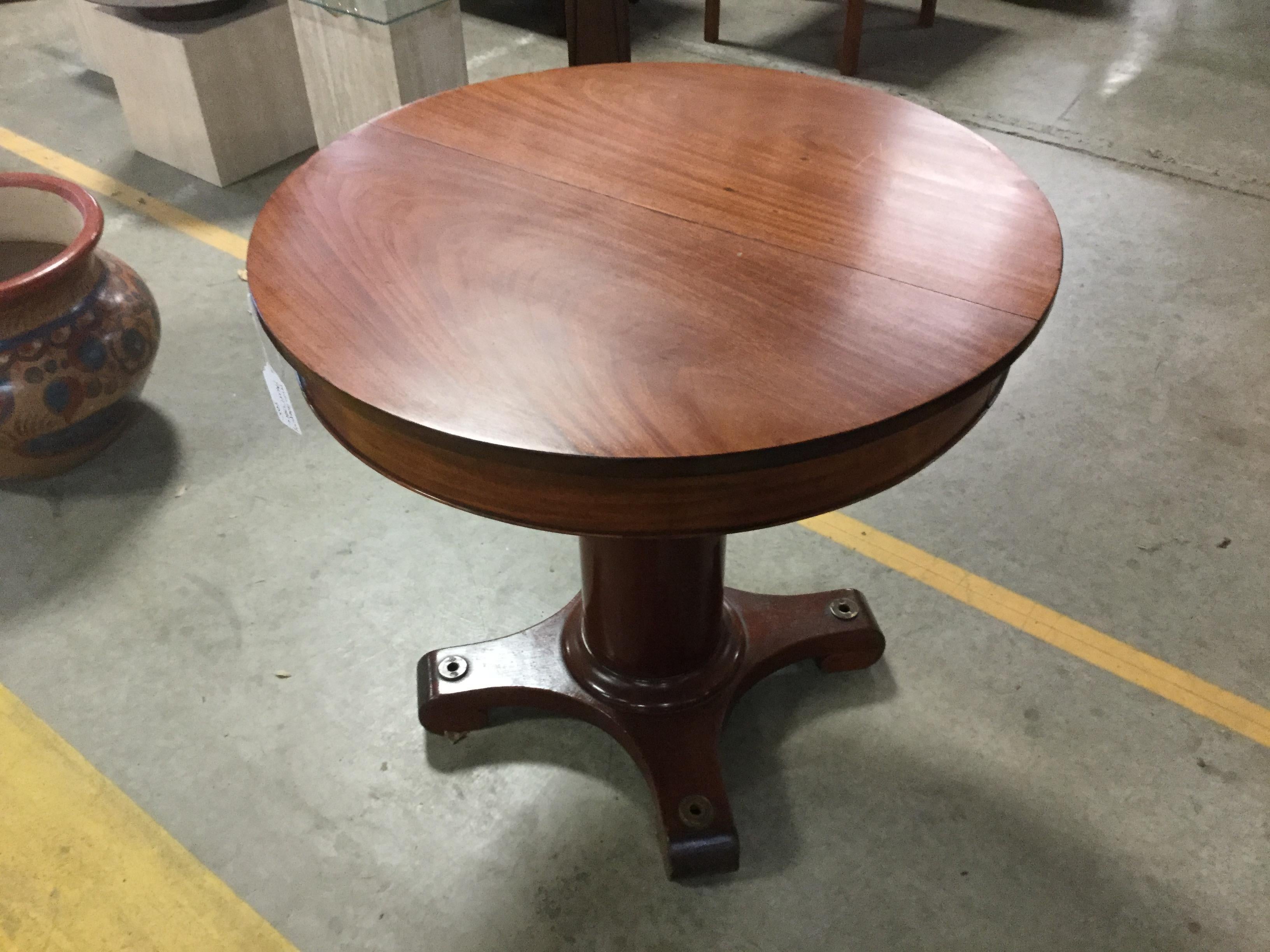 Table came from a large yacht. It has brass fittings on the feet to anchor it to the floor. Varnished cherrywood. Look great on your boat or home.