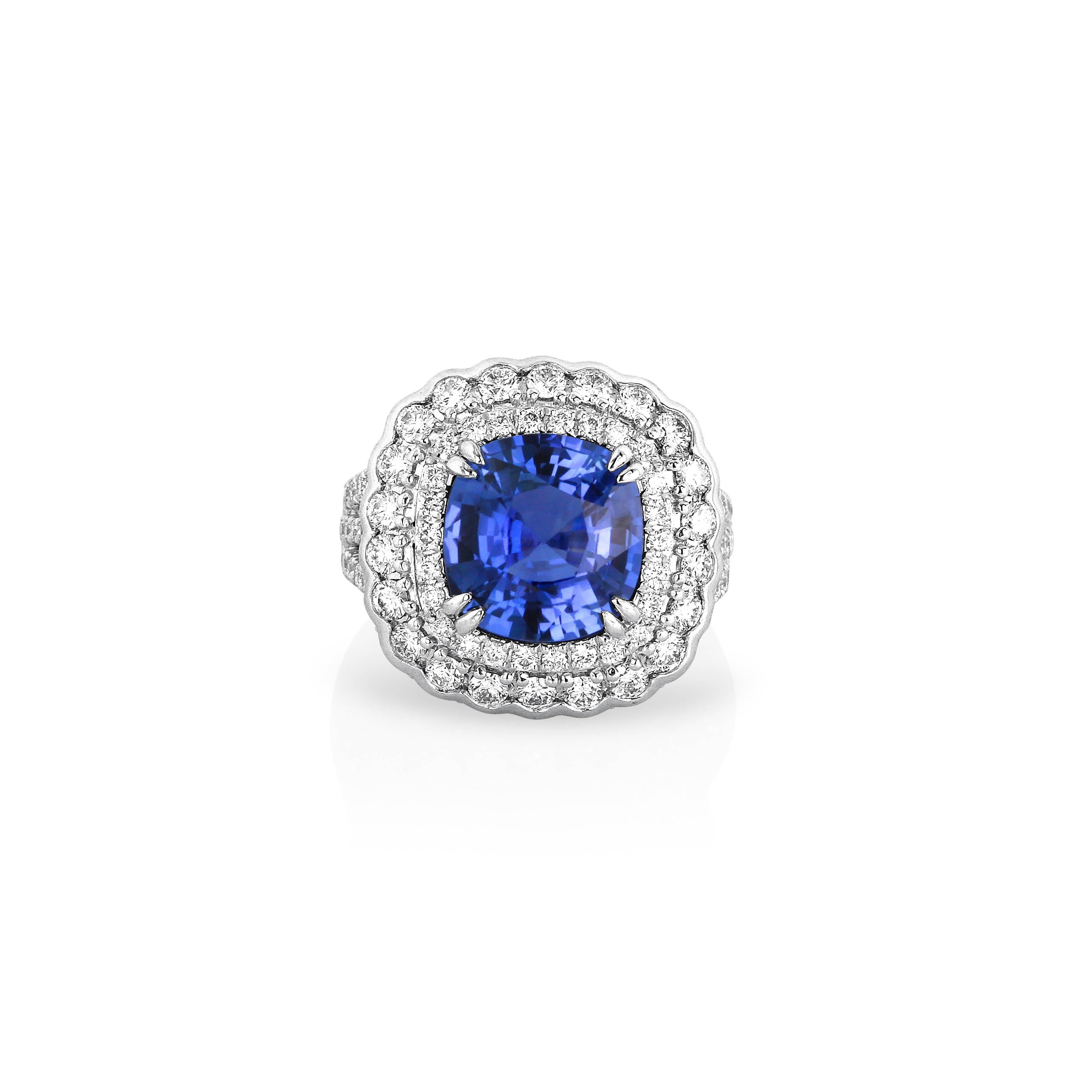 Yael Designs created a modern classic ring featuring a GRS certified cushion blue sapphire encrusted with 2.44 carats of brilliant white diamonds from halo to shank to lower gallery all mounted in platinum. 