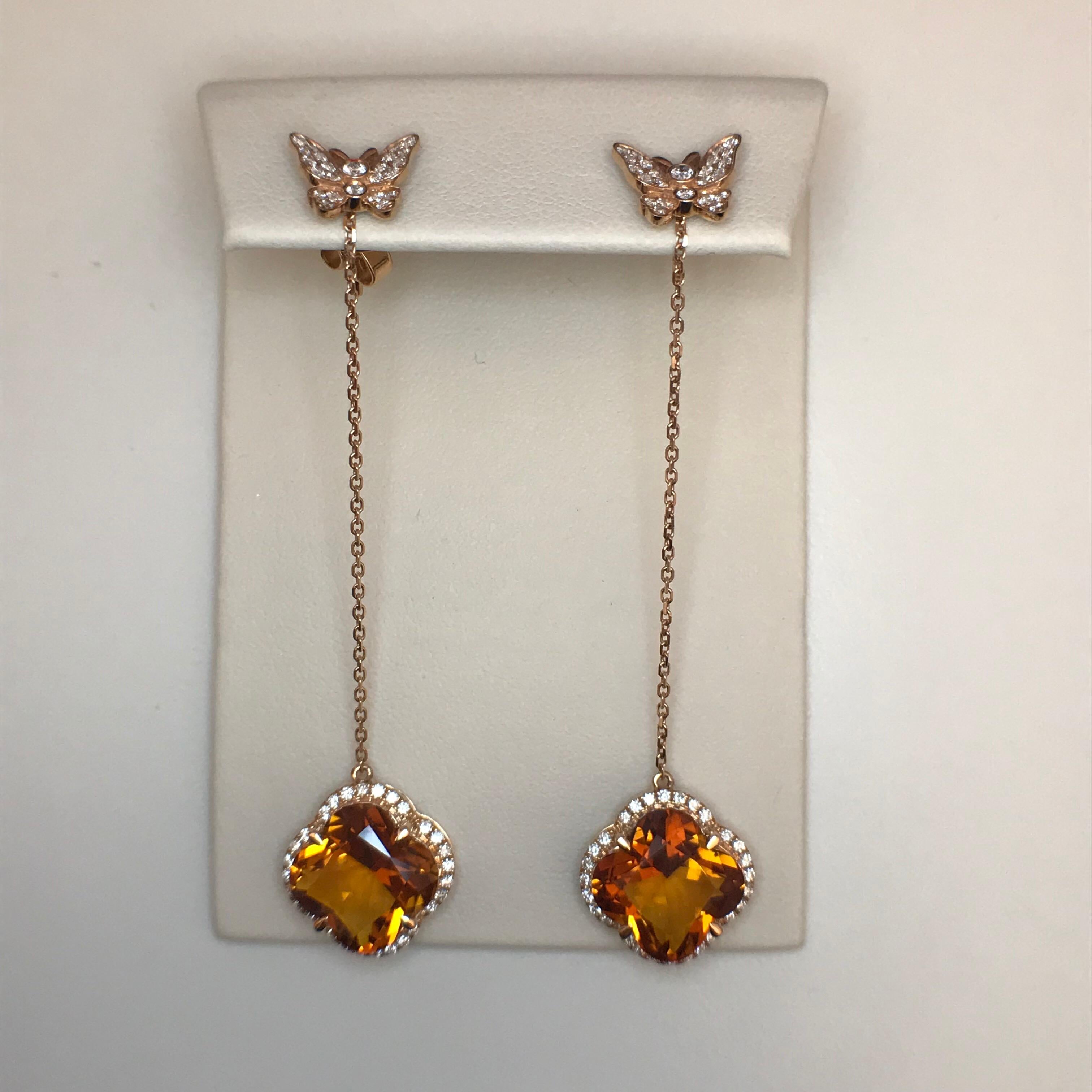 Yael Designs has created a pair of convertible earrings featuring special clover-cut Madeira Citrines dangling from two diamond pave butterflies that can be worn as studs alone! 

18kt Rose Gold
Citrine 8.74ct
White Round Diamonds 0.60ct (G color VS