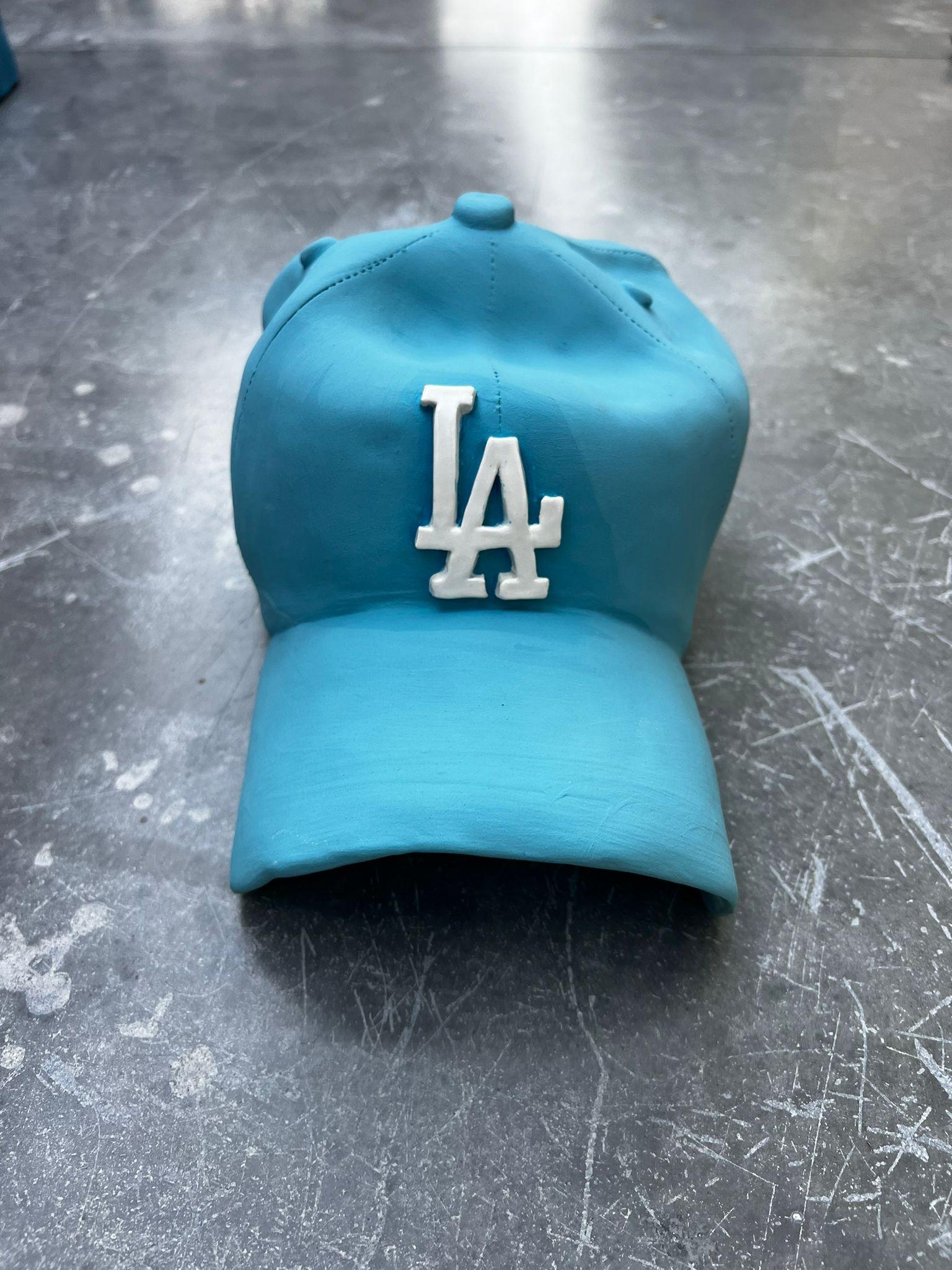 Ceramic LA Dodgers cap sculpture (light blue) - figurative sculpture - Pop Art Sculpture by Yael Yanay