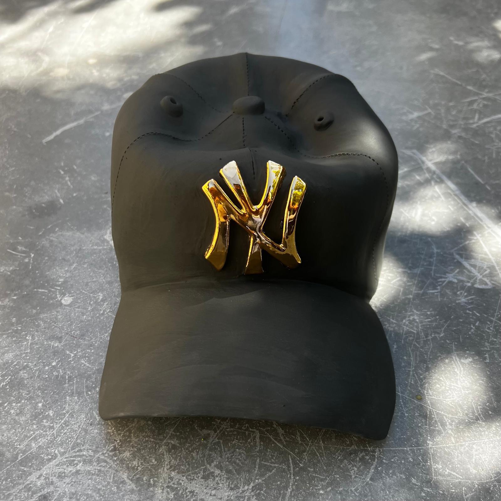 Ceramic NY Yankees cap sculpture (golden) - figurative sculpture, pop sculpture - Sculpture by Yael Yanay