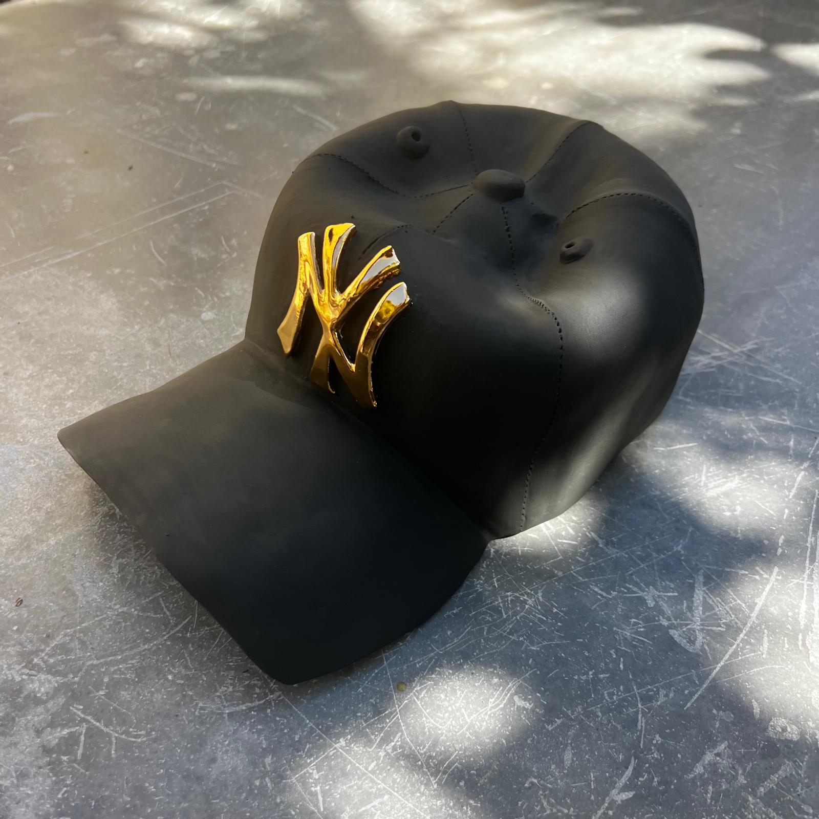 This beautiful one of a kind ceramic hand made NY Yankees cap is from Yael Yanay’s latest body of works.

These hand-crafted ceramic hats  are meticulously designed to resemble iconic baseball caps, complete with a realistic NY Yankees logo. Made