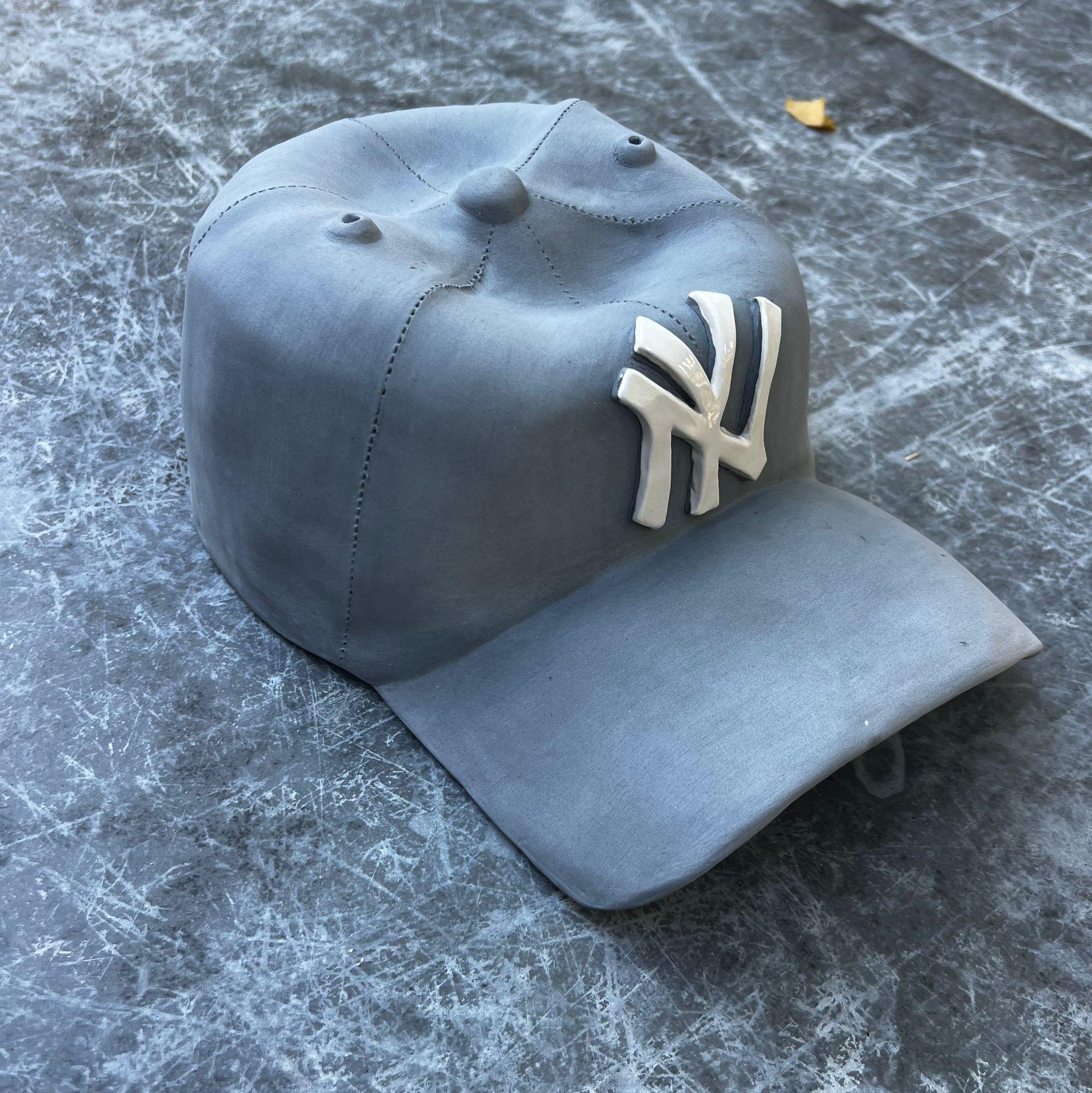 This beautiful one of a kind ceramic hand made NY Yankees cap is from Yael Yanay’s latest body of works.

These hand-crafted ceramic hats  are meticulously designed to resemble iconic baseball caps, complete with a realistic NY Yankees logo. Made