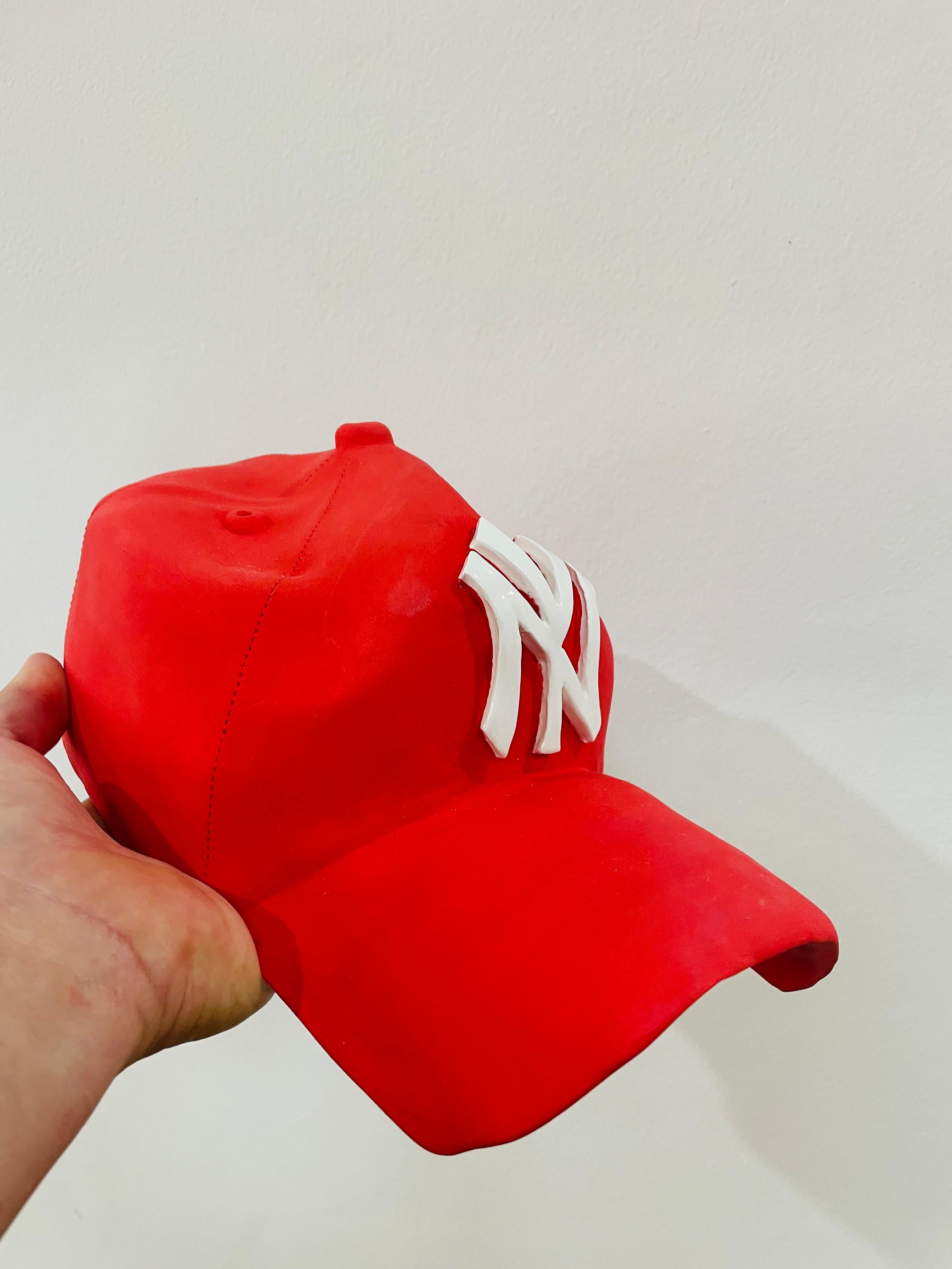 This beautiful one of a kind ceramic hand made Yankees hat is from Yael Yanay’s latest body of works.

These hand-crafted ceramic hats  are meticulously designed to resemble iconic baseball caps, complete with a realistic New York Yankees logo. Made