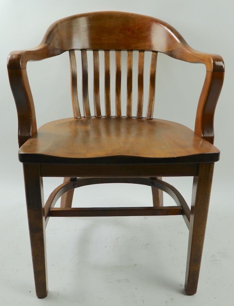 Early 20th Century Walnut office, desk chair attributed to Gunlocke. Clean ready to use condition. Total H 33 x Arm H 28 x Seat H 18.