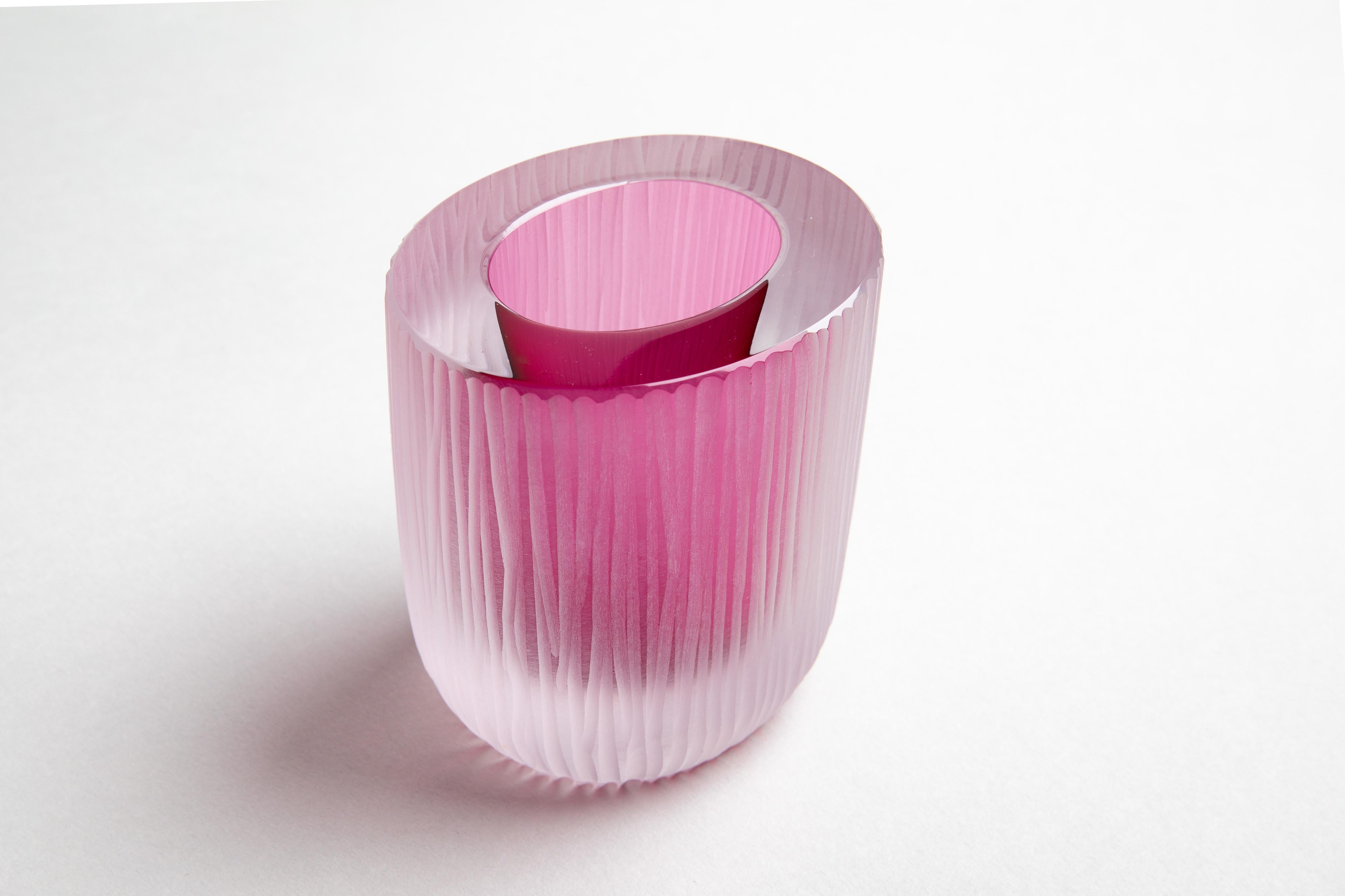 A small yet solid object with a strong presence, the Kasa container is skilfully crafted by a glass master using a technique involving the layering of cristallo glass to a core of intense colour. Once cooled the blown glass body is cut in half, hand