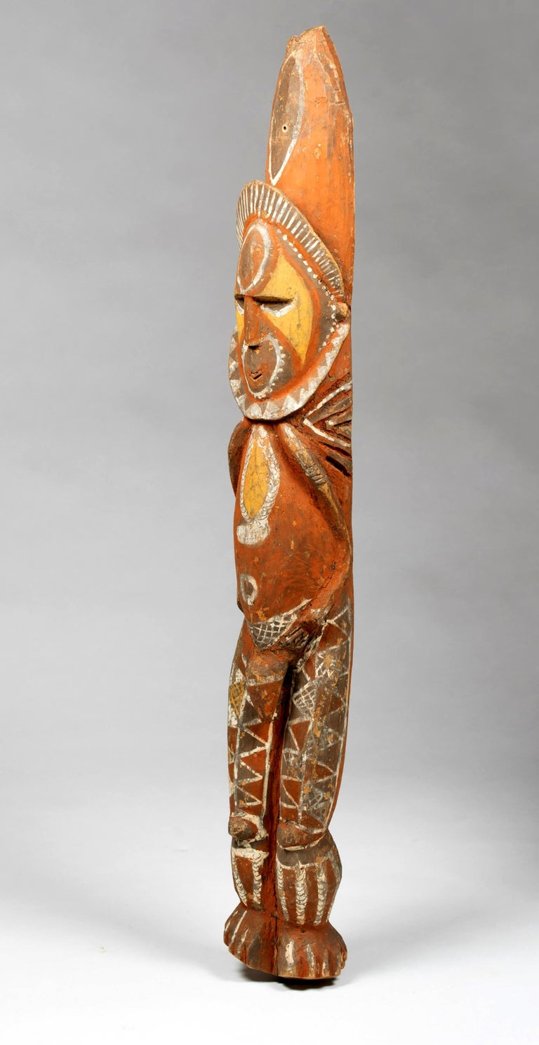 A yam ancestor TOTEM pole from the mid-Sepik River region of Papua New Guinea. Carved out of a solid wood by the Abelam people, who cultivated yams as their main crop, the pole features the classical form of the Yam ancestor in his frontal pose. It