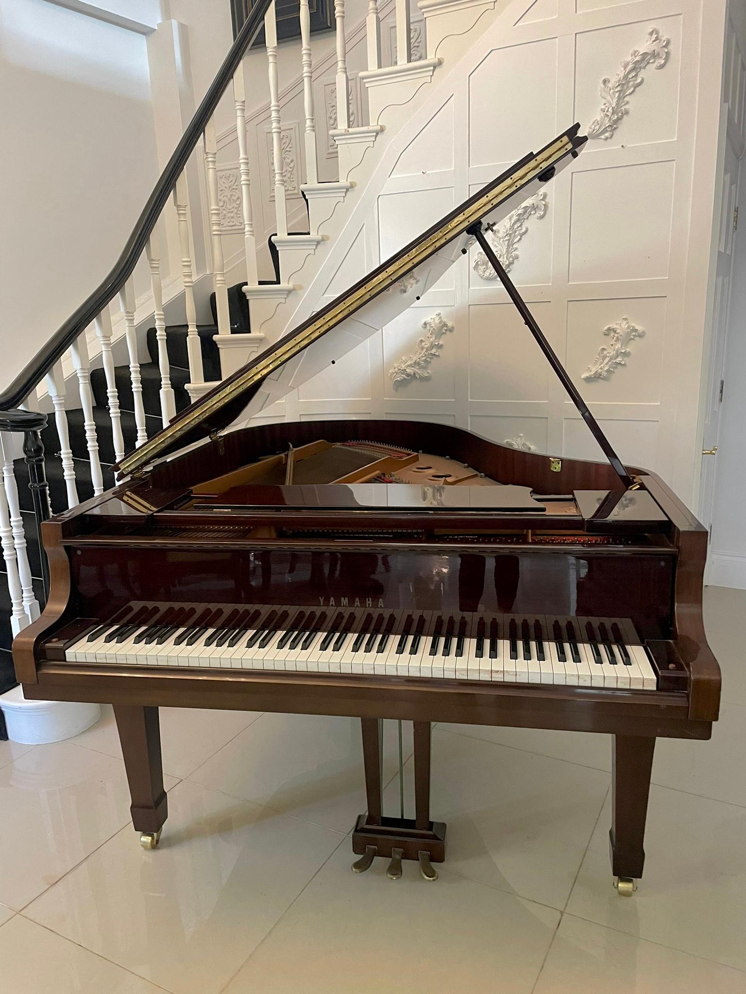 Quality Yamaha baby grand piano with an overstrung iron frame, frame and sound board in perfect condition, mahogany case standing on square tapering legs with spade feet brass castors 

An elegant classic example in wonderful