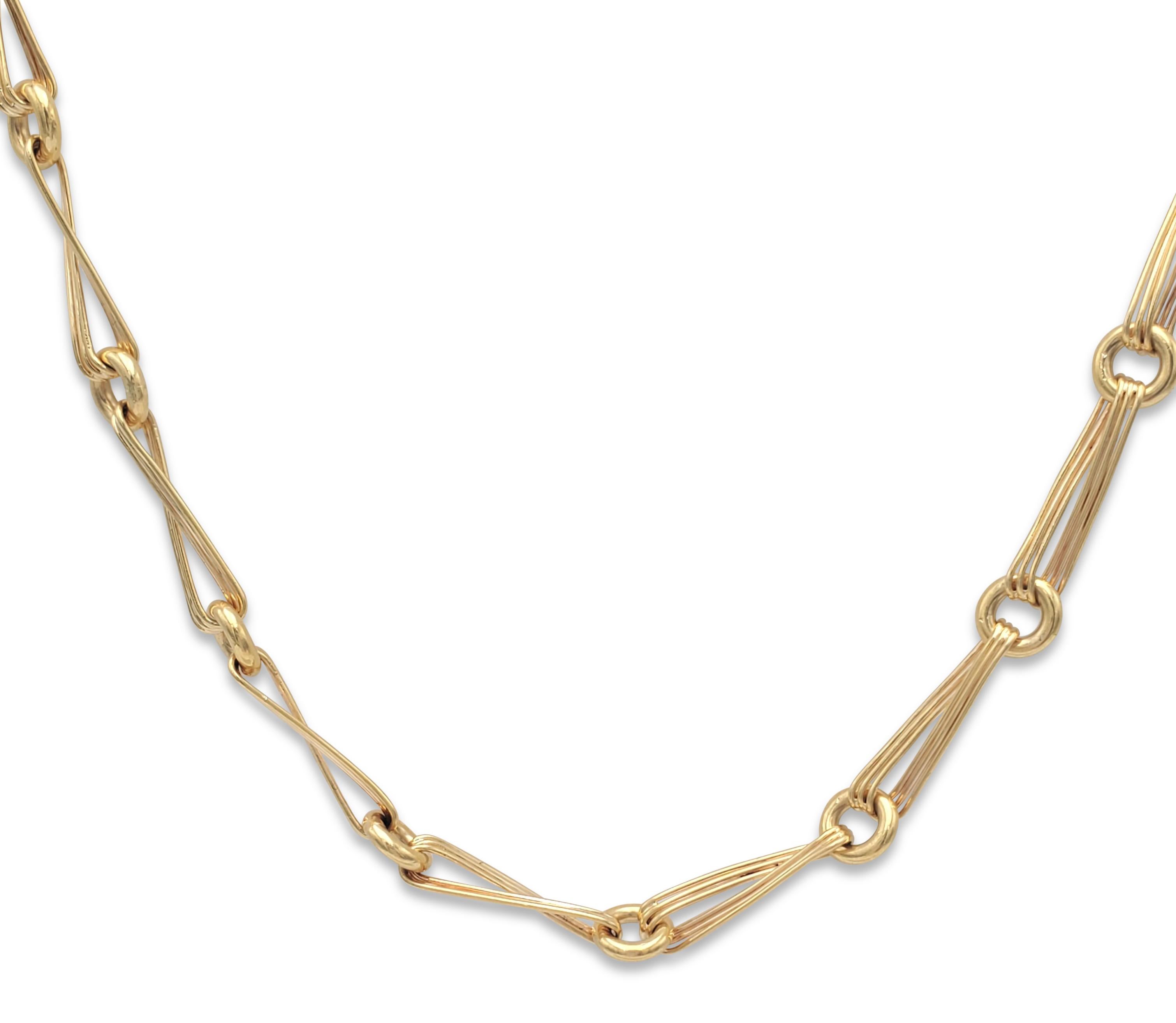 An enchanting necklace crafted in 18 karat yellow gold with uniquely designed switchback links and featuring a pave disk set with 15 round-cut diamonds weighing an estimated .15 cttw.  The chain measures 30.5 inches in length and can be placed over