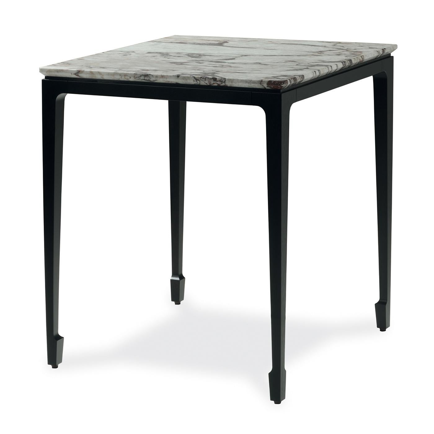 Part of the Yang collection of side tables, this piece is a stunning addition to a modern home. Either alone or combined with the others in black or durmast finish, this side table will be an elegant display surface for collectibles, a practical