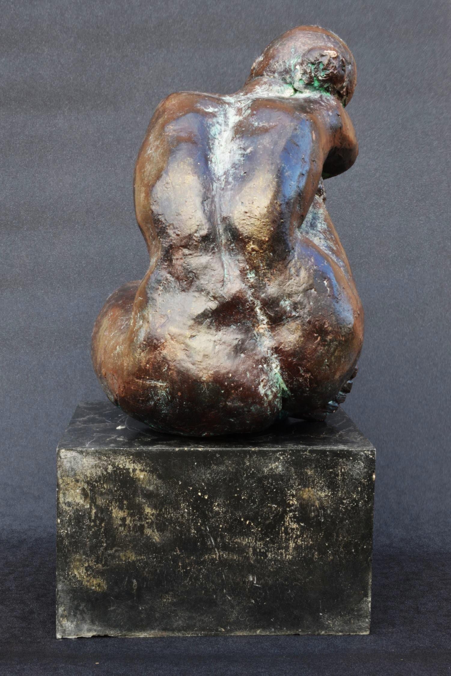 Thought is a bronze sculpture by Yann Guillon of a reflexive woman sitting head on shoulder. This French contemporary artist focuses his work on the human body, using an expressionist approach to convey alternately strength or sensuality. 