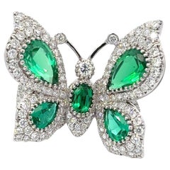 Vintage Yanush 18k White Gold 6.32ct Synthetic Emerald and 3.57ct Diamond Butterfly Ring