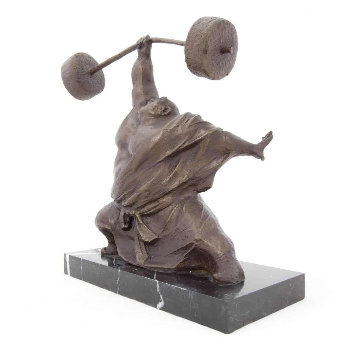 Chinese Contemporary art sculpture. Weight lifter, body builder with bar bell. Yaohui Wu was born on November 2, 1964 in China. Passionate about painting, calligraphy and sculpture, he turned to boxwood carving under the tutelage of master Jinshun
