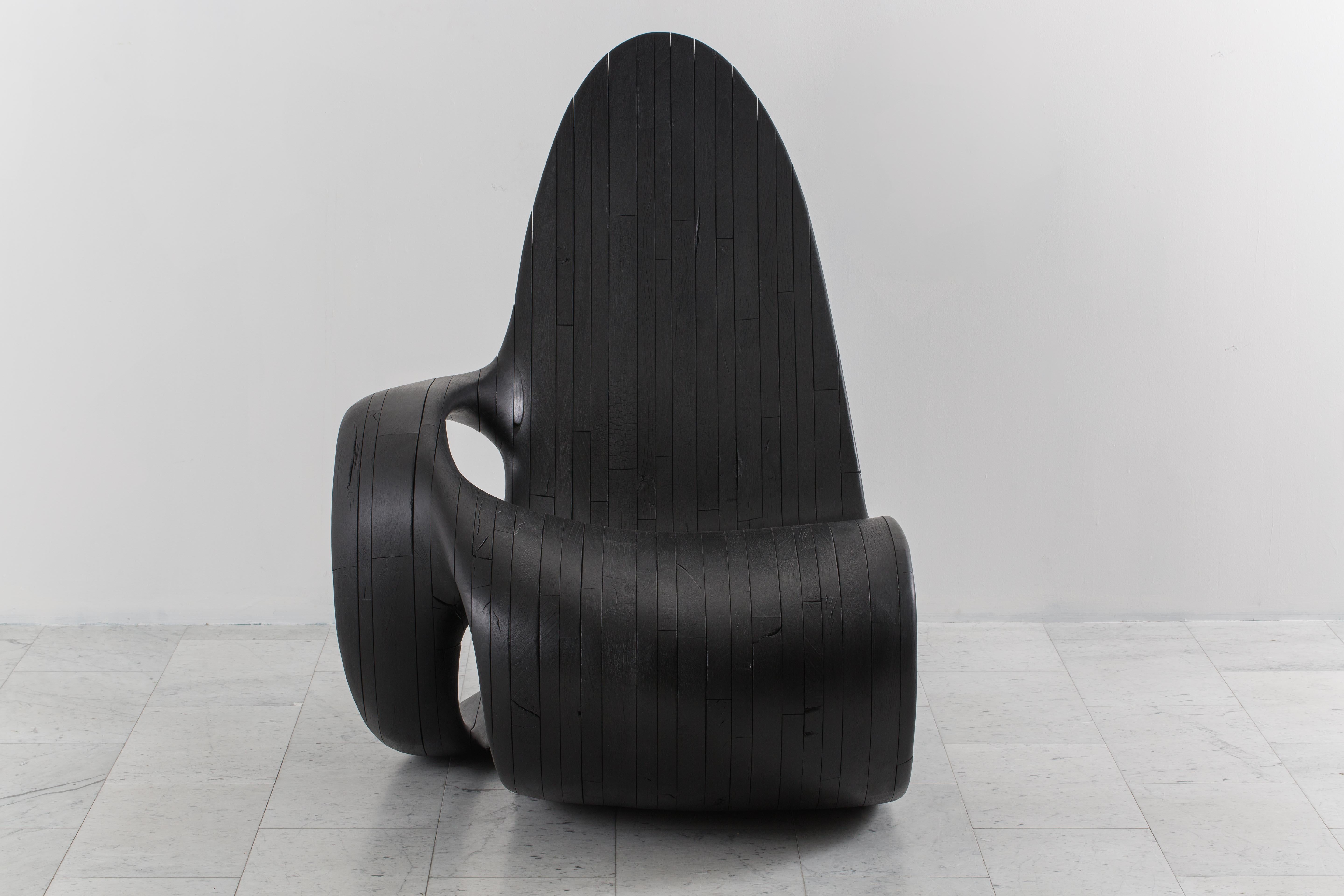 A unique, material-driven sculptural chair by Ian Spencer and Cairn Young of Yard Sale Project, Black Tongue explores unprecedented forms in wood. The wood is finished using the shou-sugiban method, an ancient Japanese finishing technique that