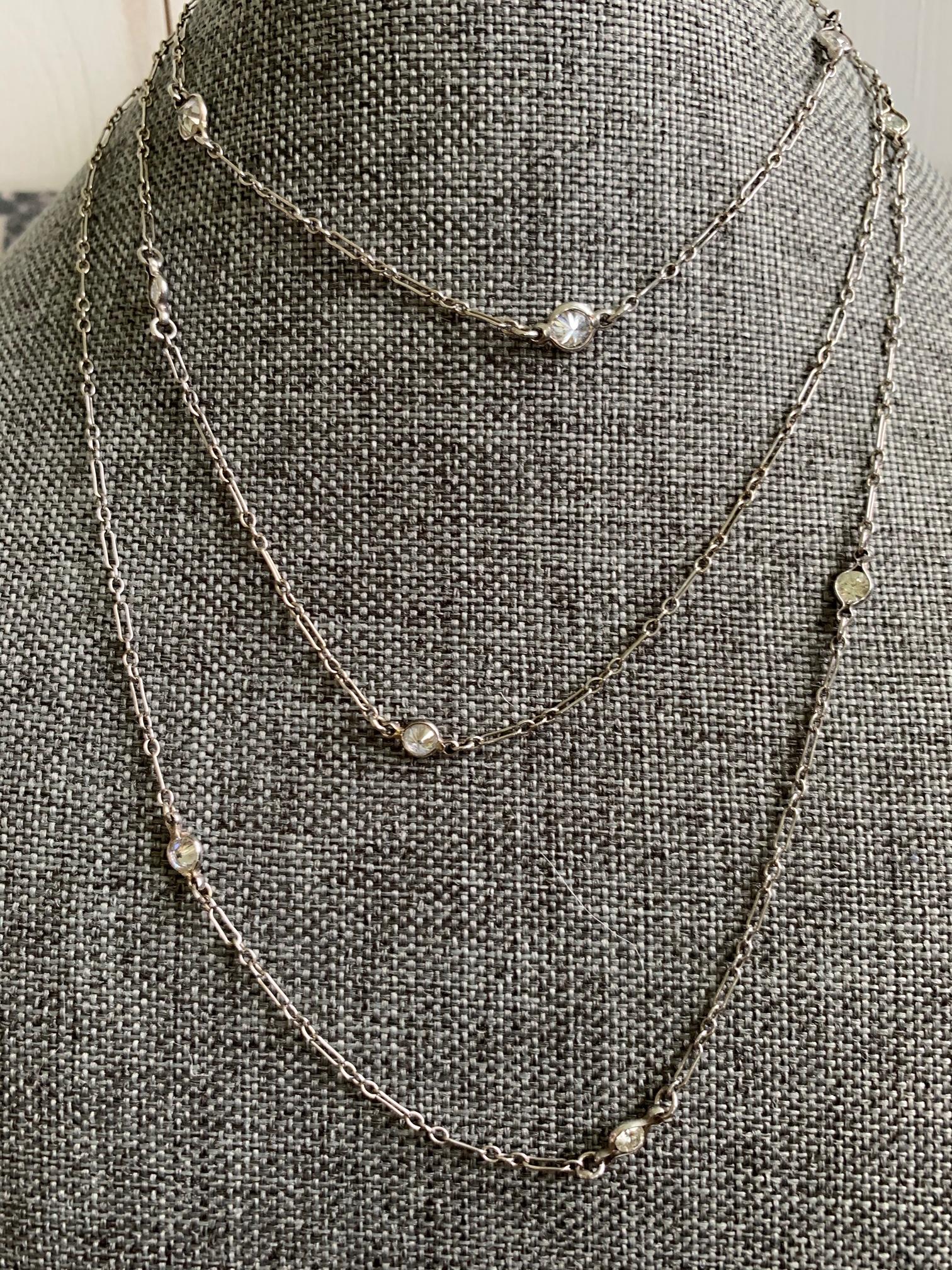 This necklace design only gets better with age; in other words, it's ageless!  This beautiful, sleek, long and 14k white gold has 13 diamonds, graduated in weight and size, dotted throughout the length of the chain.  

The 13 brilliant cut diamonds