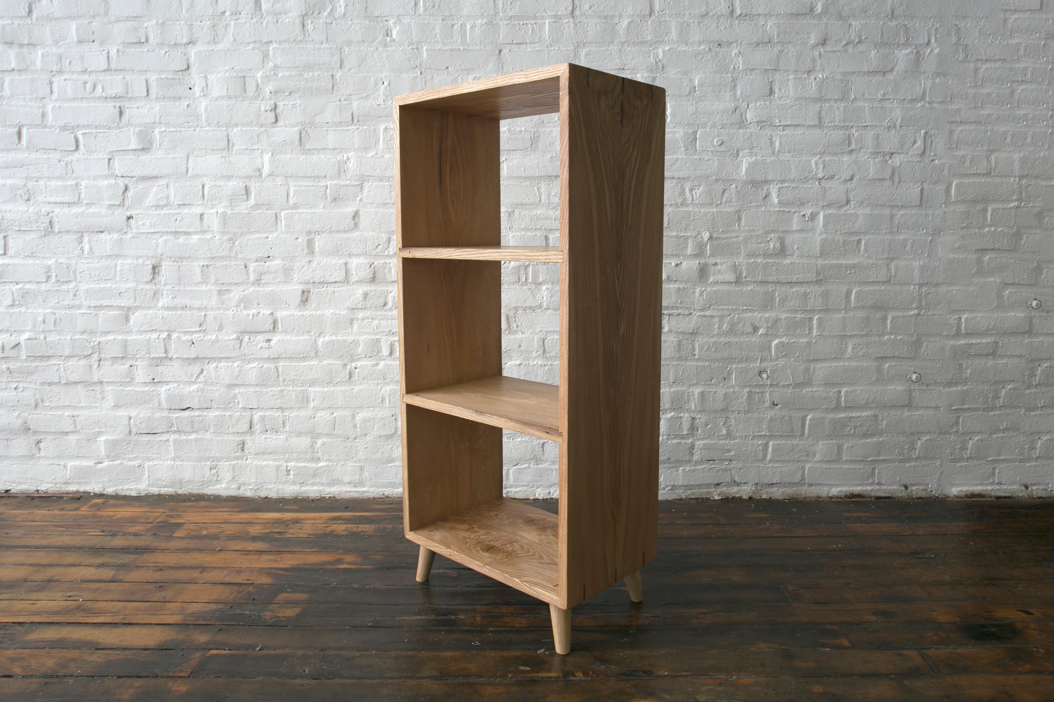 This modular piece is designed to be a flexible alternative to traditional shelving. It can be placed against a wall or as a freestanding room divider and used to store records, books, boxes and more. The free standing shelf has a beautiful