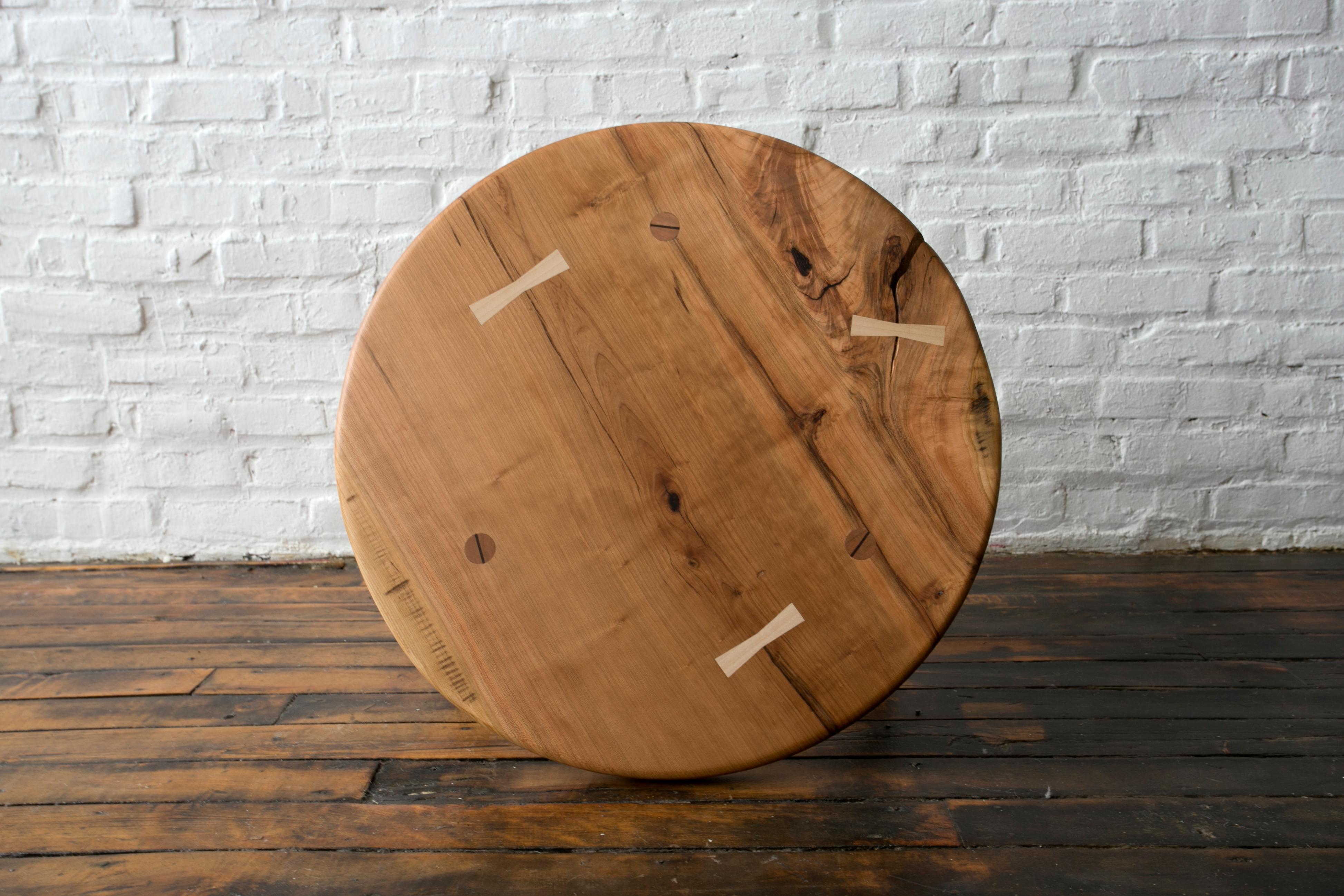 We’ve created several versions of our coffee table over the years, eventually landing on this design. The simple circular top draws out the depth in the grain, and celebrates the structure of the tree it was made from. The base is a self reinforcing