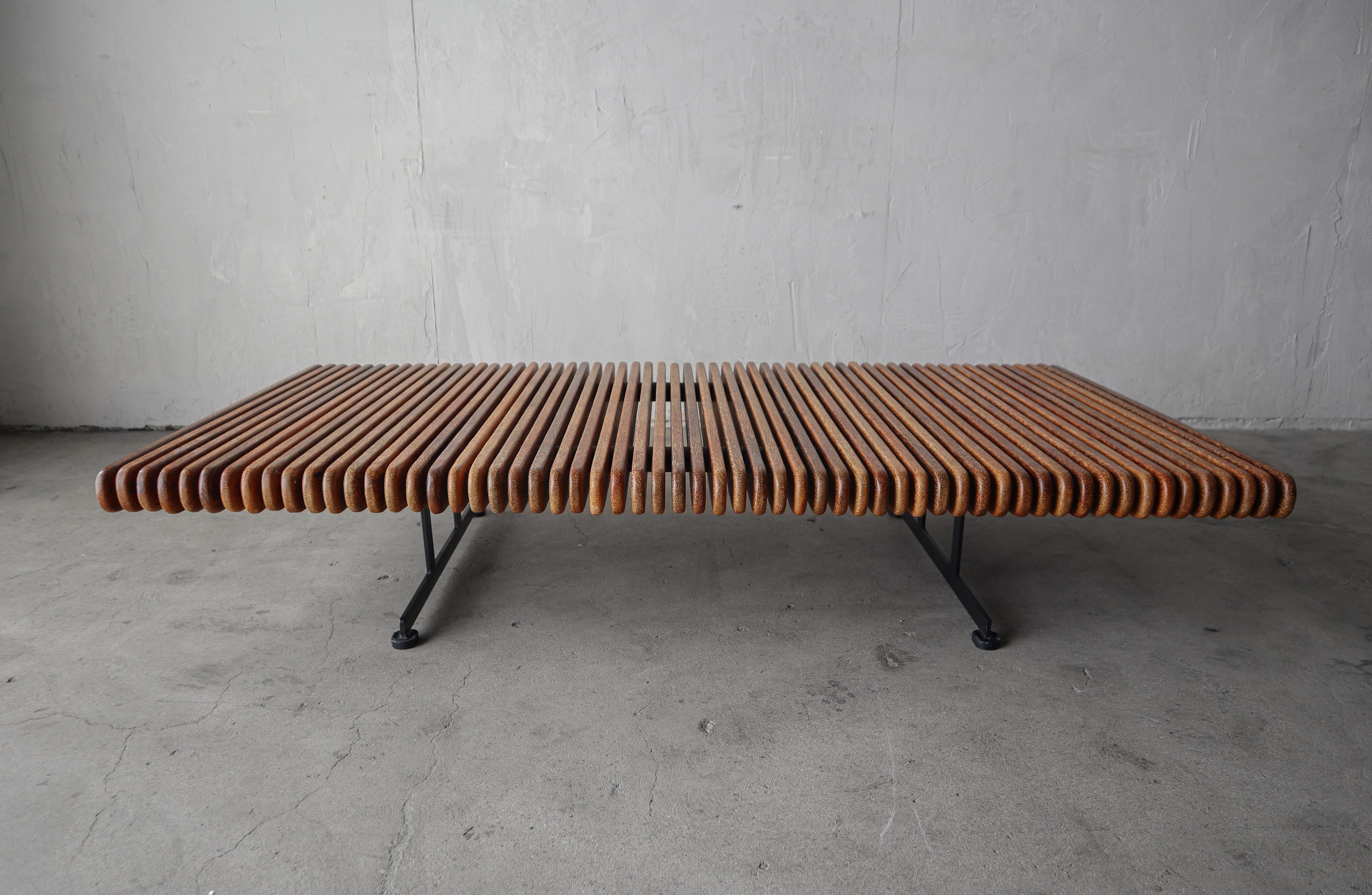 This gorgeous Pacific Green Palmwood® Slat Bench Coffee Table is part of their Yasawa Collection.  This coffee table is RARE and was of limited production, it is extremely hard to find especially now that the entire Yasawa collection has been