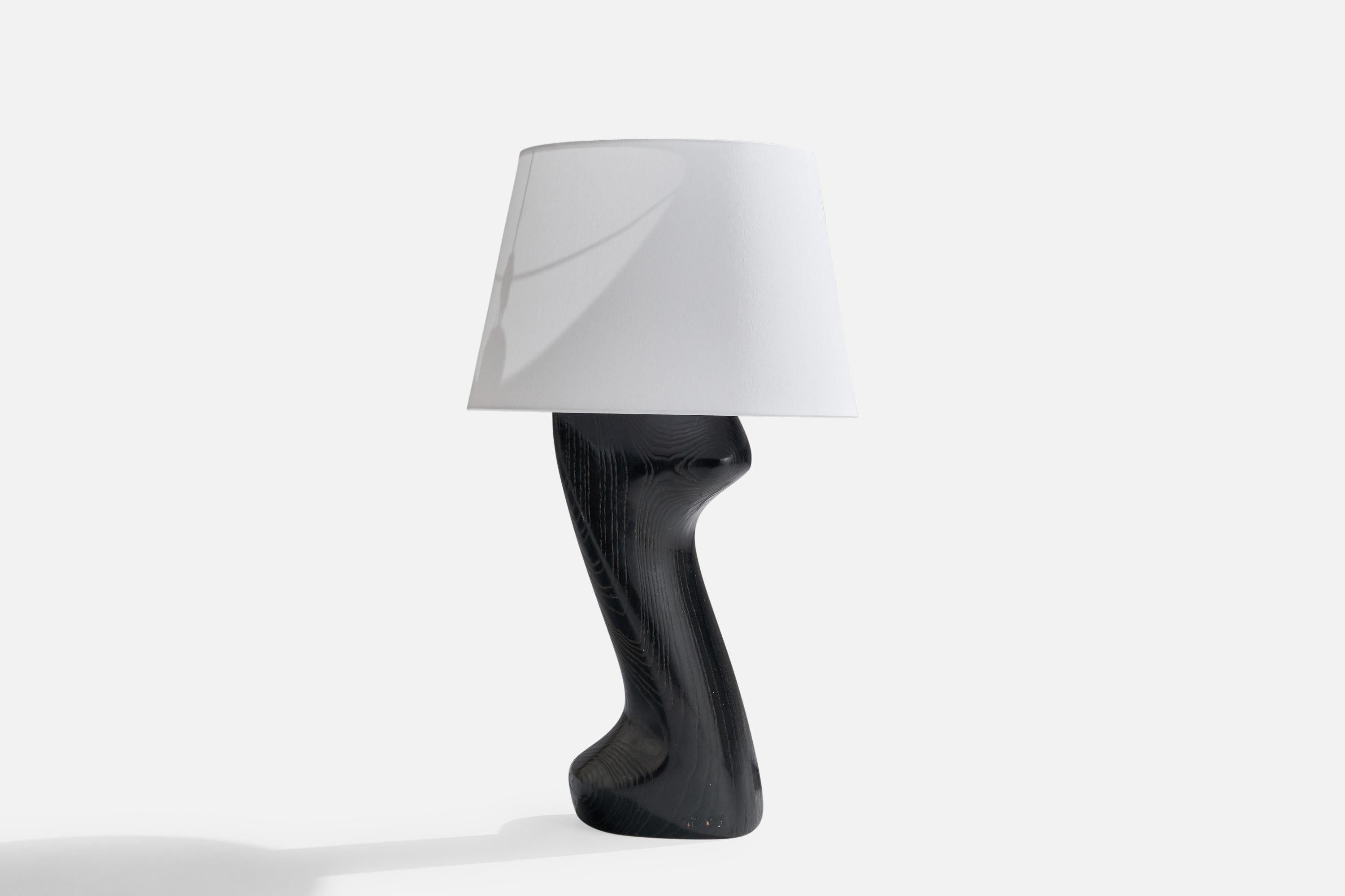 A black-cerused oak table lamp attributed to Yasha Heifetz, USA, 1950s.

Dimensions of Lamp (inches): 23.50” H x 8” Diameter
Dimensions of Shade (inches): 9” Top Diameter x 12”  Bottom Diameter x 9” H
Dimensions of Lamp with Shade (inches): 28” H x