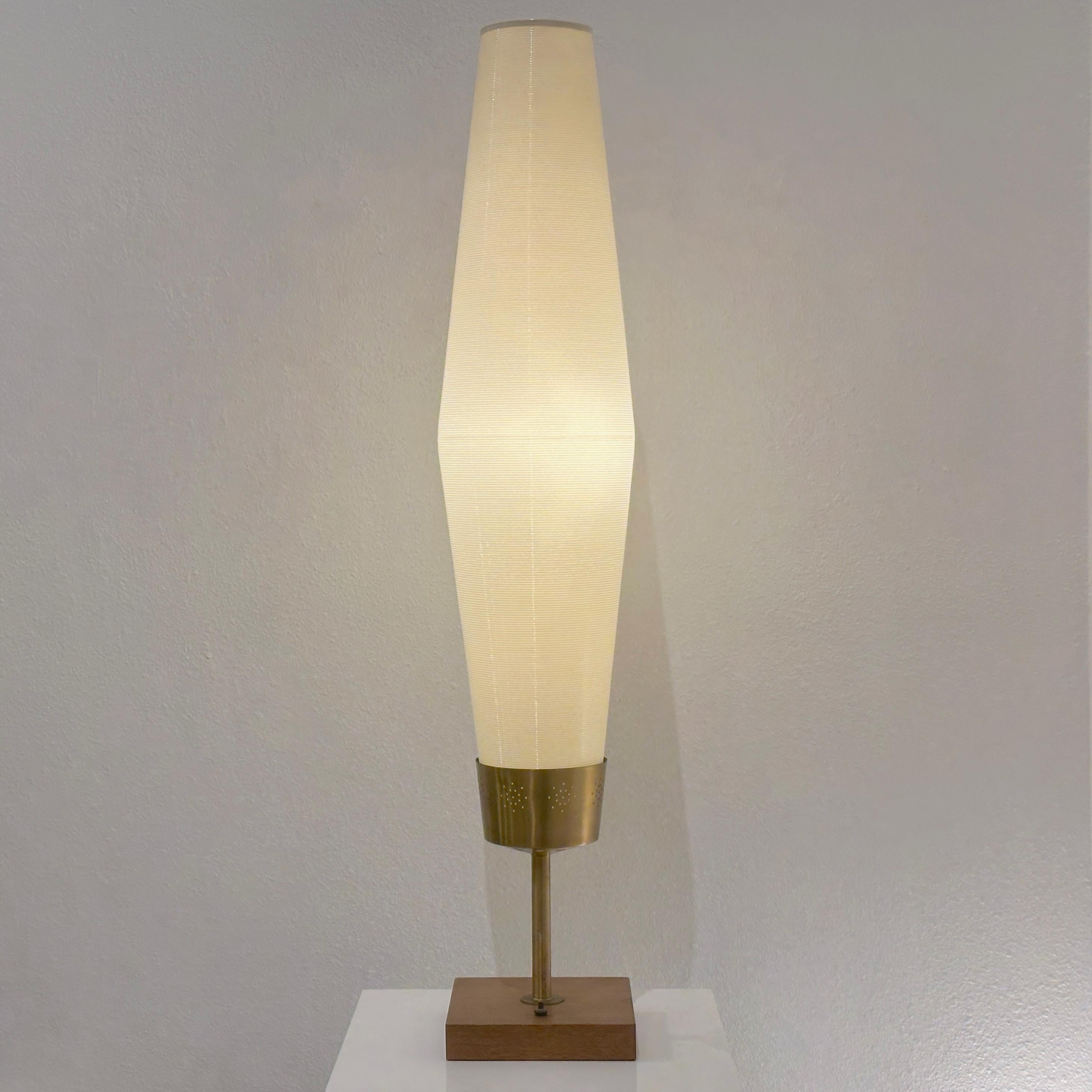 Yasha Heifetz Rotaflex Table Lamp, ca 1950s

A rare version of the Heifetz Rotaflex lamp featuring a spun plastic cord shade that rests inside a pierced brass receptacle that mounts on a brass post that attaches to a walnut base. Very striking and